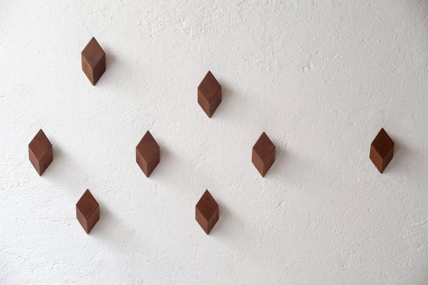 Pipa is a wall hanger inspired by lapidary and its quality to reveal beauty under raw material. The wood is polished by simple and precise cuts.