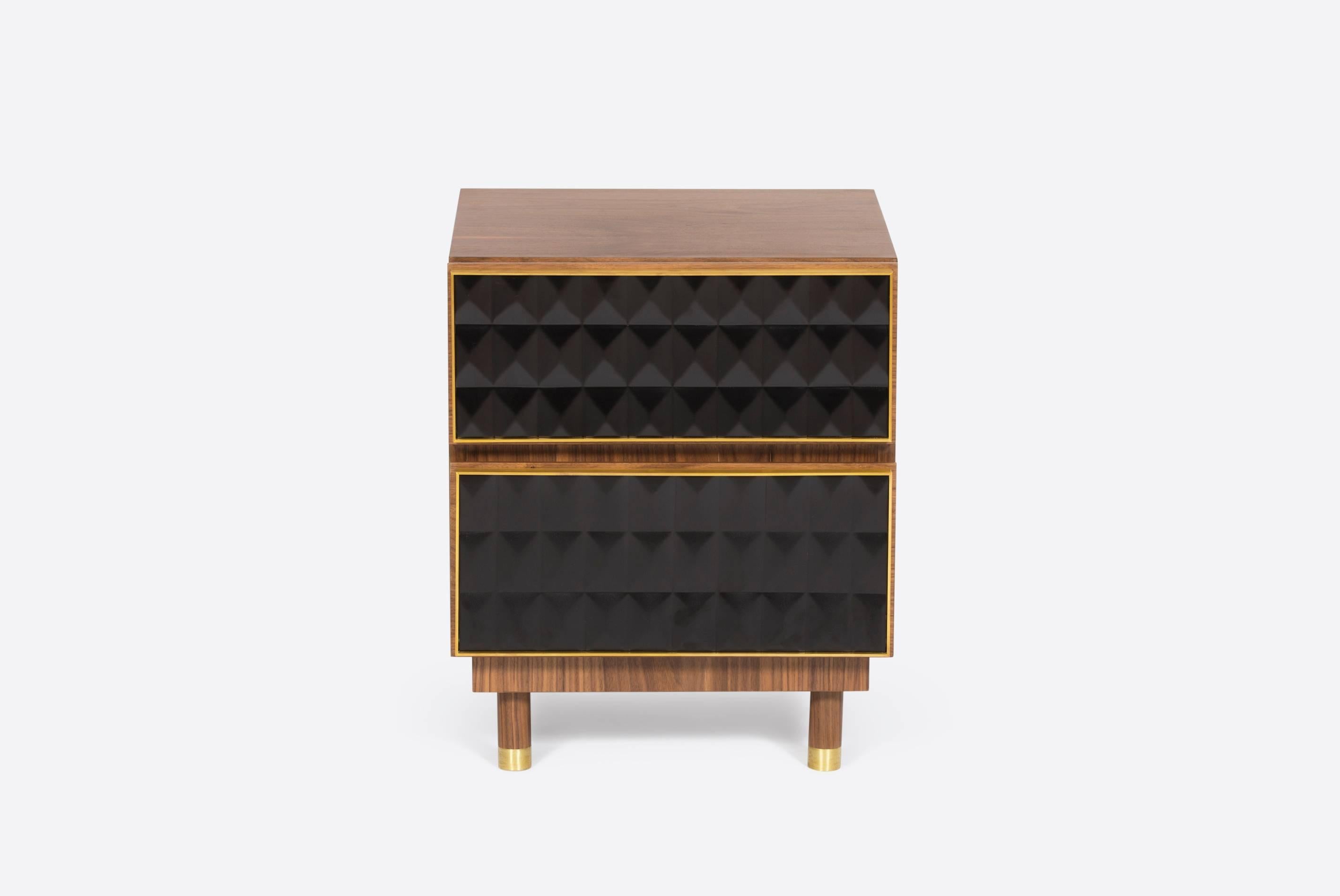 This nightstand, made of brass and walnut, inspired in the mix of materials used in the 1950s architecture, from doors to facades of large buildings. The use of clean lines, geometric figures and characteristic patterns from that era. Created in a