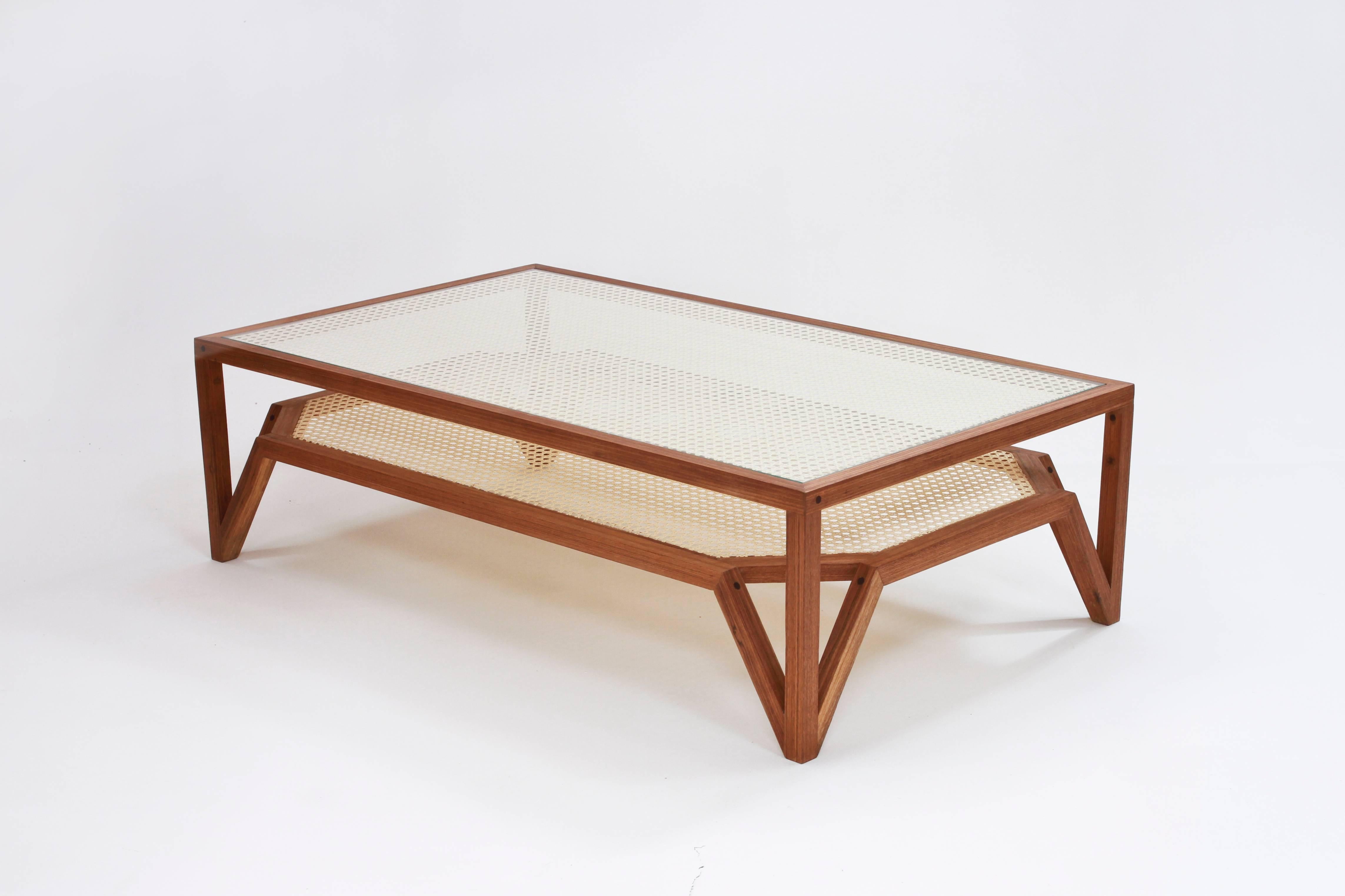 The coffee table was designed to simulate the moiré pattern, a visual effect that occurs when viewing a set of lines or dots that overlaps on another set of lines or dots, where the sets differ in size, angle, or spacing. In order to create this