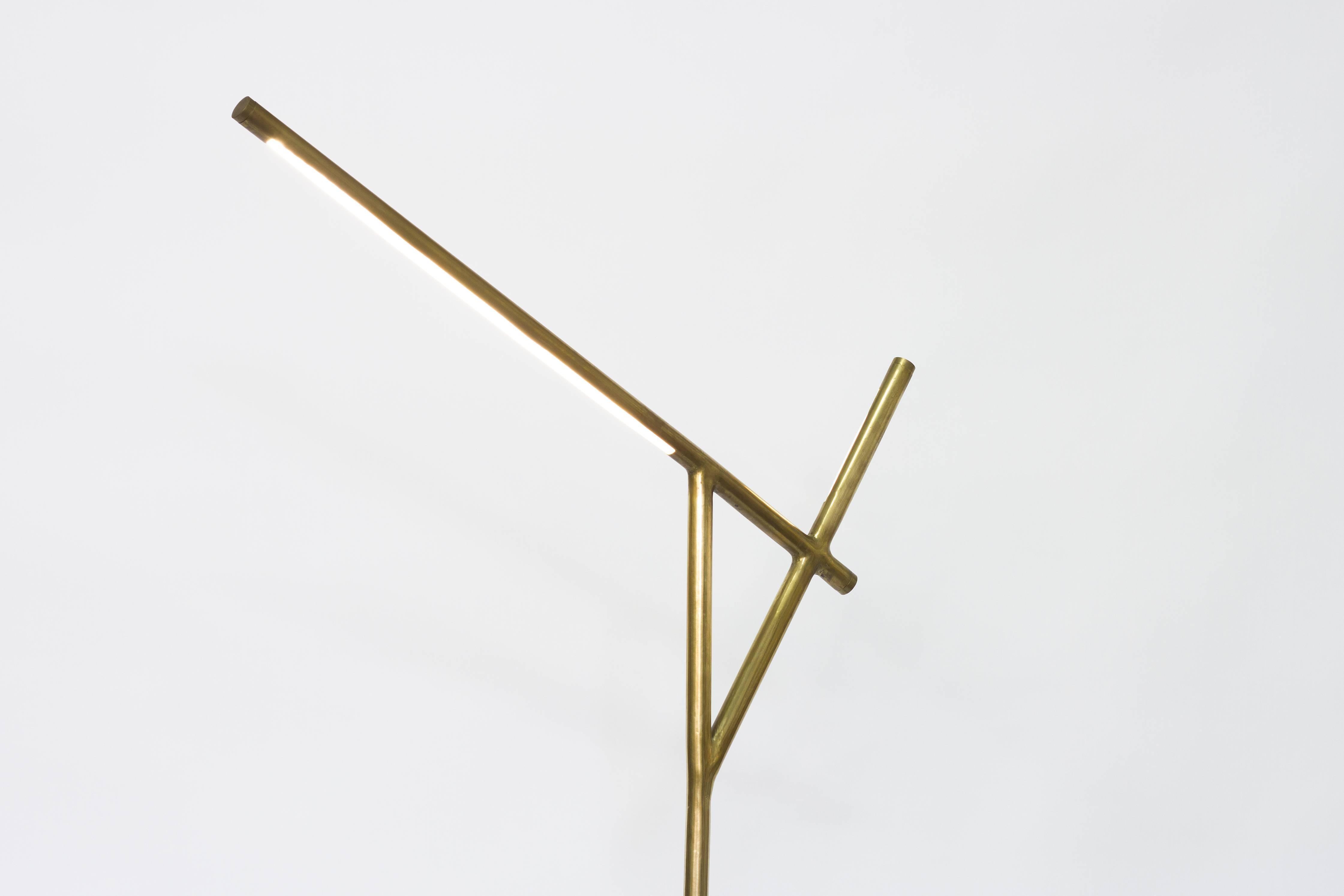 This Floor Lamp is a unique piece and makes part of Formigueiros Series.
The lamp is made out of an aluminum cast in an anthill mold, resin, and brass. To create this piece it was extracted with molten aluminum the unknown and unexpected geometry of
