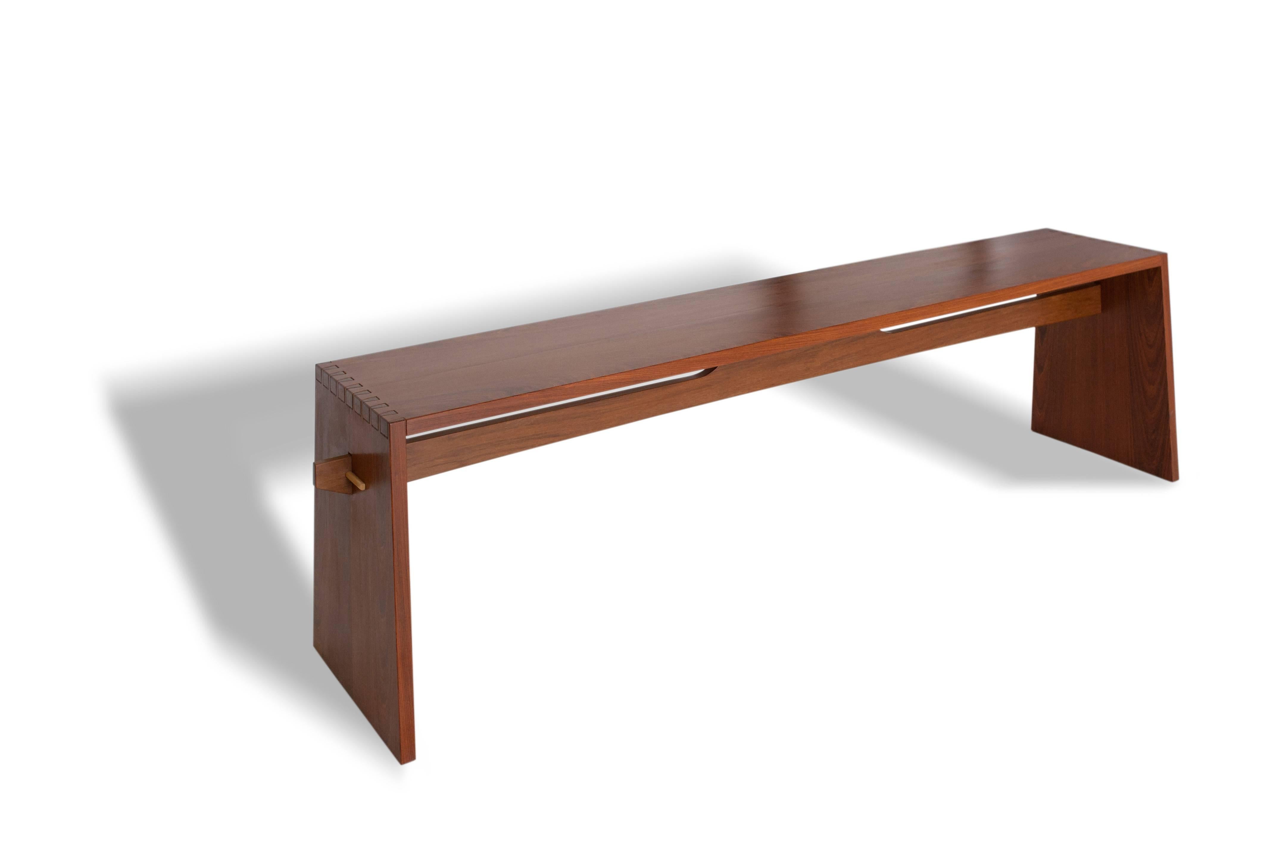Tropical Brazilian hardwood bench, hand crafted in a contemporary style made with angled dovetail and spindle joints.

The beauty of tropical hardwood joined in traditional way with dovetails and 
Measurements are customized by demand.