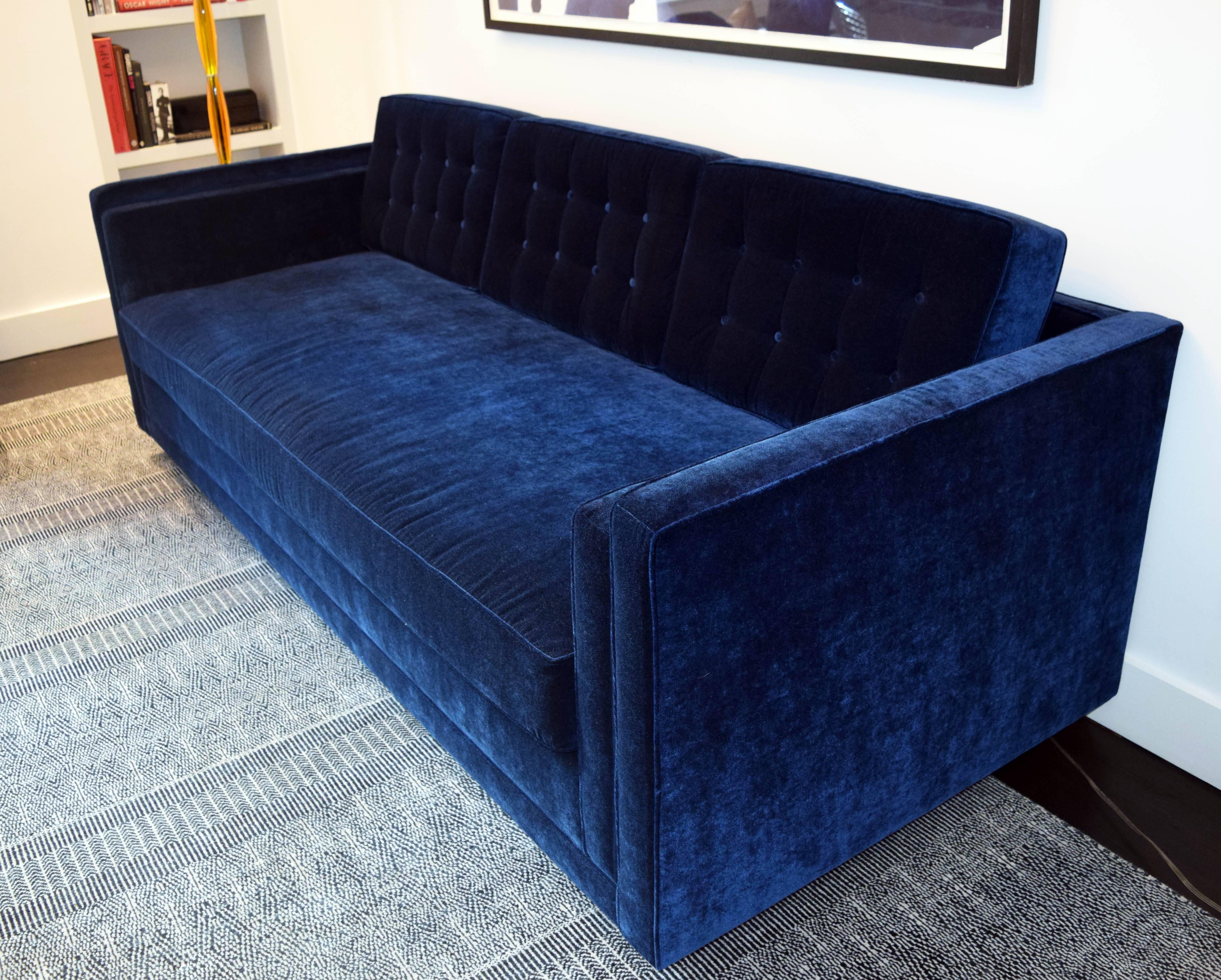A tailored contemporary tufted back and arm three-seat sofa. Back cushions are removable, converting this sofa into nearly a twin sized bed. Solid American maple frame construction, with the highest grade quality using organic latex core -