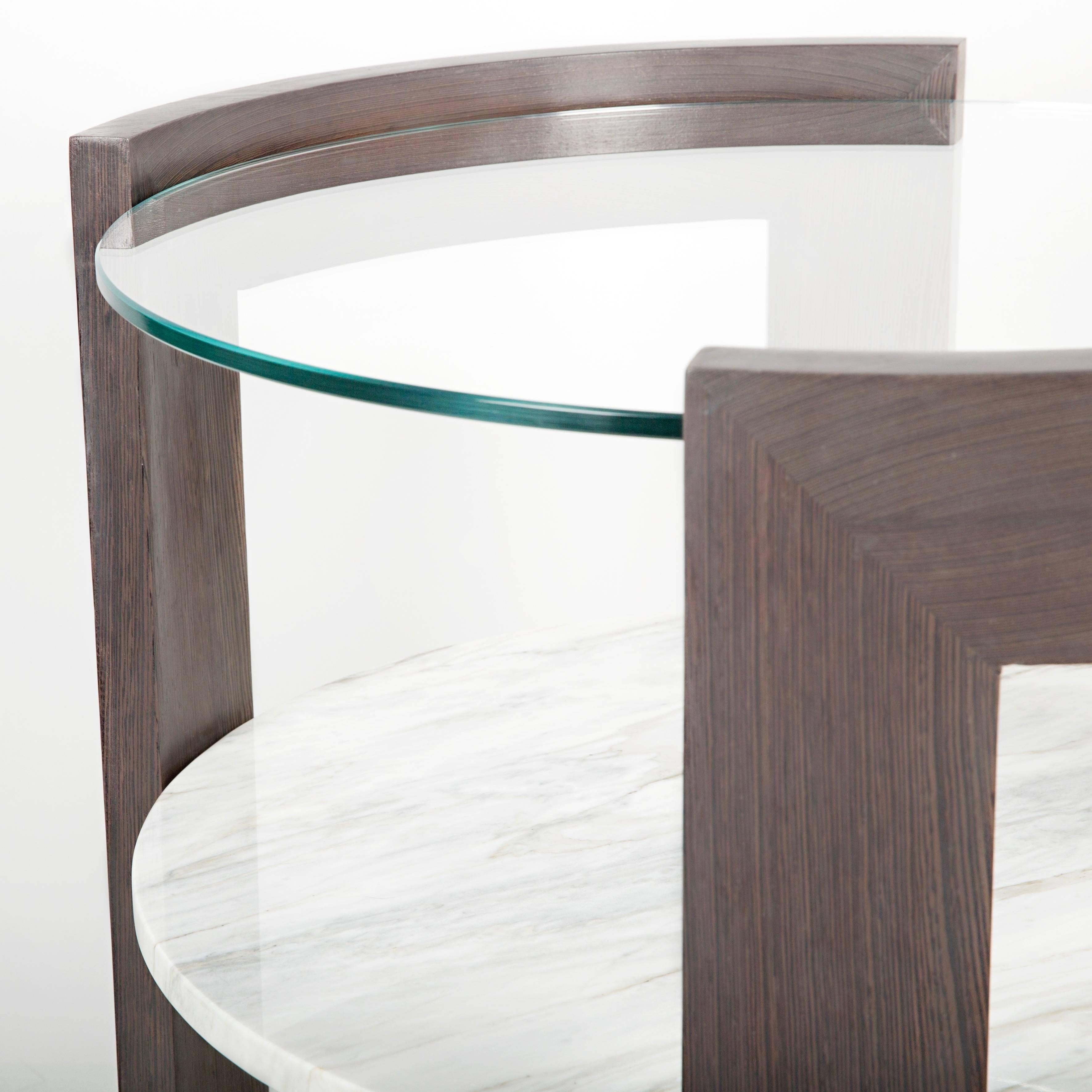 A perfectly scaled modern side table with mixed materials. Solid curved wood with unique marbles and star fire glass. Meant for the end of your sofa, between two chairs or even large enough for a nightstand. We made sure the scale of this side or