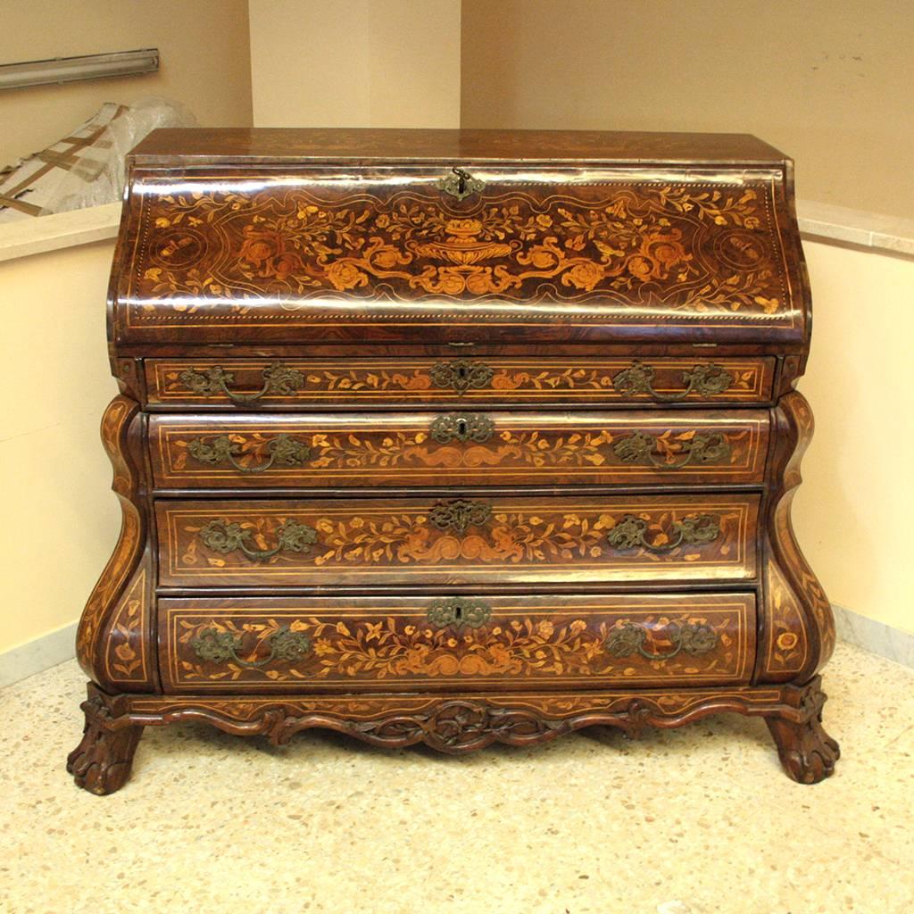 Impressive and antique 18th century (the mid of 18th century) Dutch burr walnut and floral marquetry ‘bombe’ bureau.
Very high quality in marquetry and construction using the finest materials.
This Bureau is the one of the best expressions, of