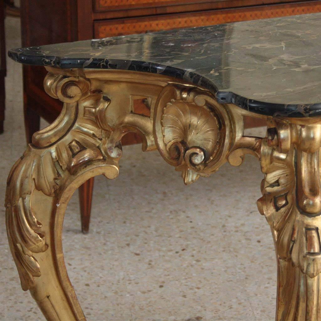 Early 19th century Italian gilded marble-top console tables
Gilded console, in its original state, of a very elegant shape and of great quality in engravings and details.
First period of the 19th century
The top, with original and rare marble.