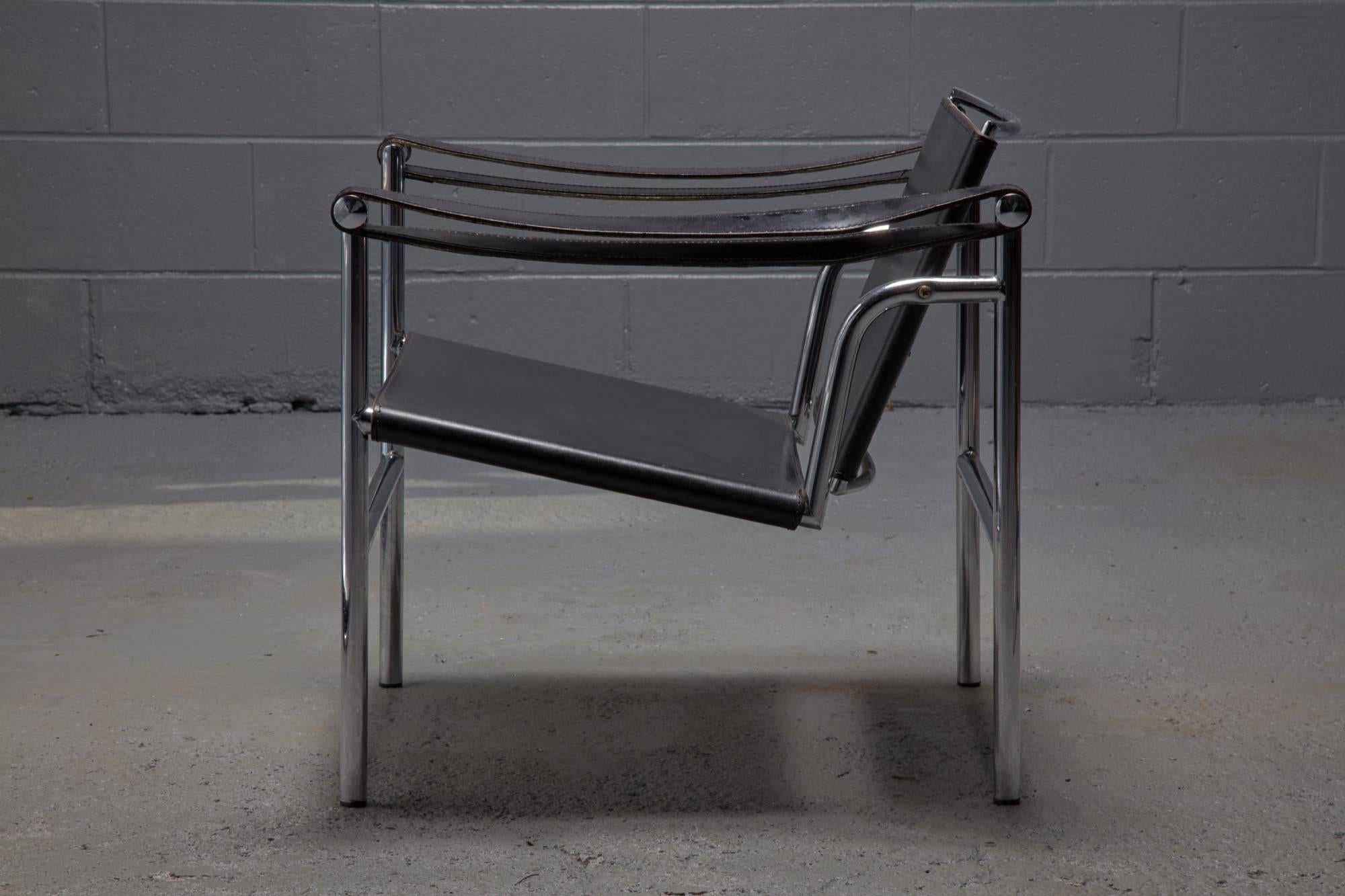 Designed in 1928 for Cassina, Le Corbusier, Pierre Jeanneret and Charlotte Perriand the sleek LC1 Chair is constructed with a polished, chrome-plated steel frame and black leather seat and back. A key feature of the chair is its adjustable back,