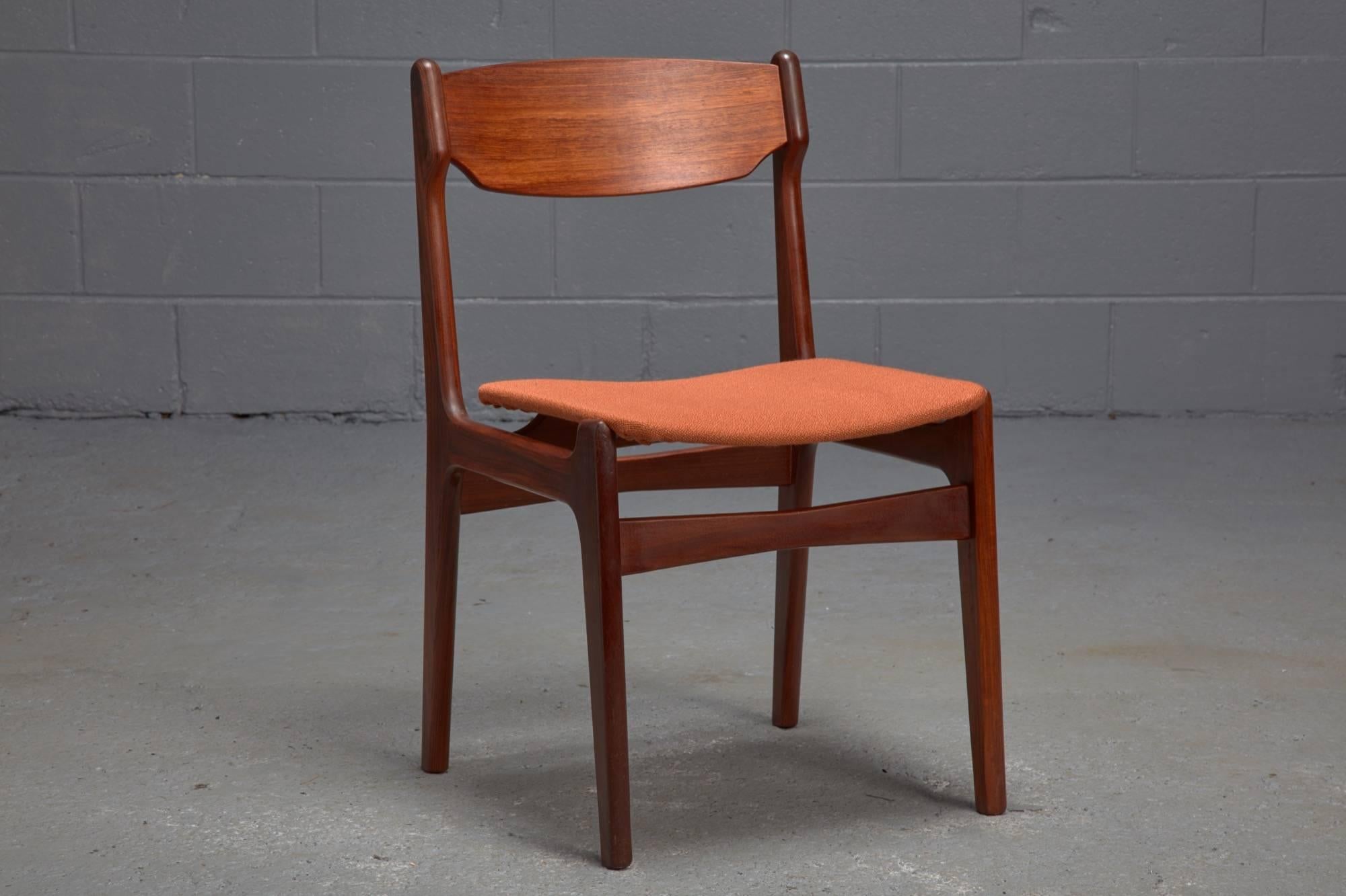 Teakwood frames and orange wool-upholstered seats are featured in this set of dining chairs. Sold as a set of six.