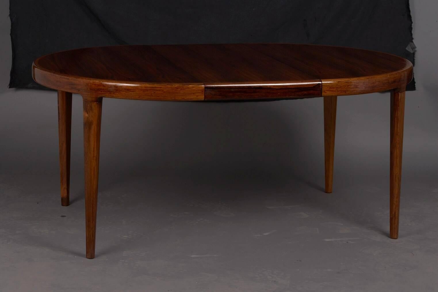 Danish rosewood extension dining table. Burled rosewood veneer used for top. Includes two 19 inch leaves. Dimensions with both leaves installed: 85 in L x 47 in W x 29 in H.