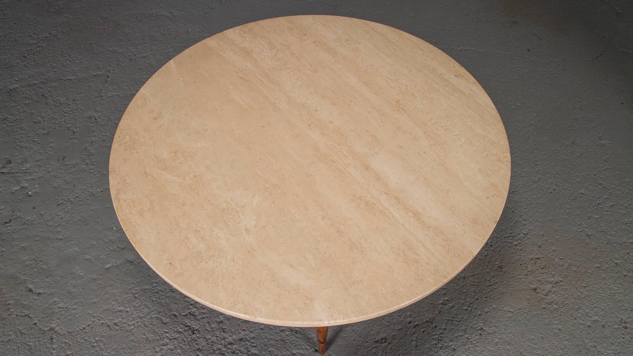 Made of travertine, walnut, and brass, this Mid-Century Modern coffee or cocktail table was designed by Paul McCobb for the Conoisseur collection.