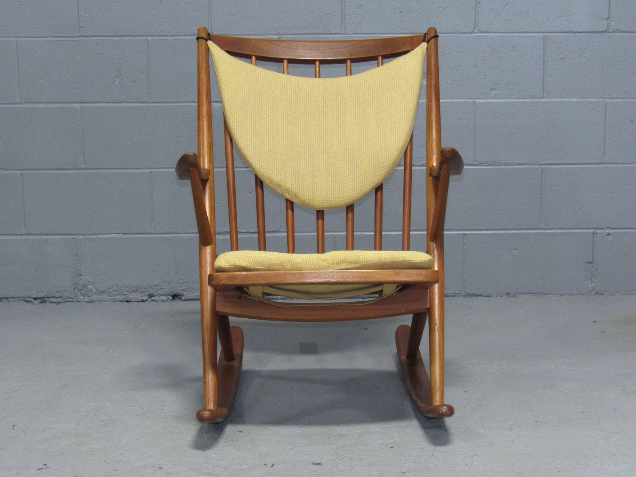 Danish teak rocking chair by Frank Reenskaug for Brahmin with loose cushions.