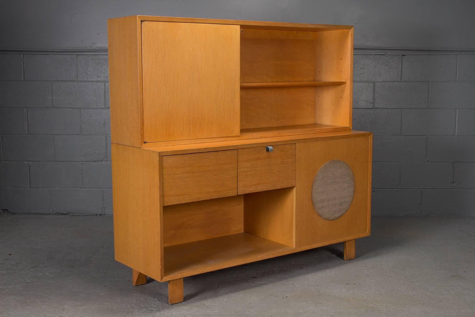 Stereo cabinet by George Nelson for Herman Miller. Original radio and record player intact. Two pieces.