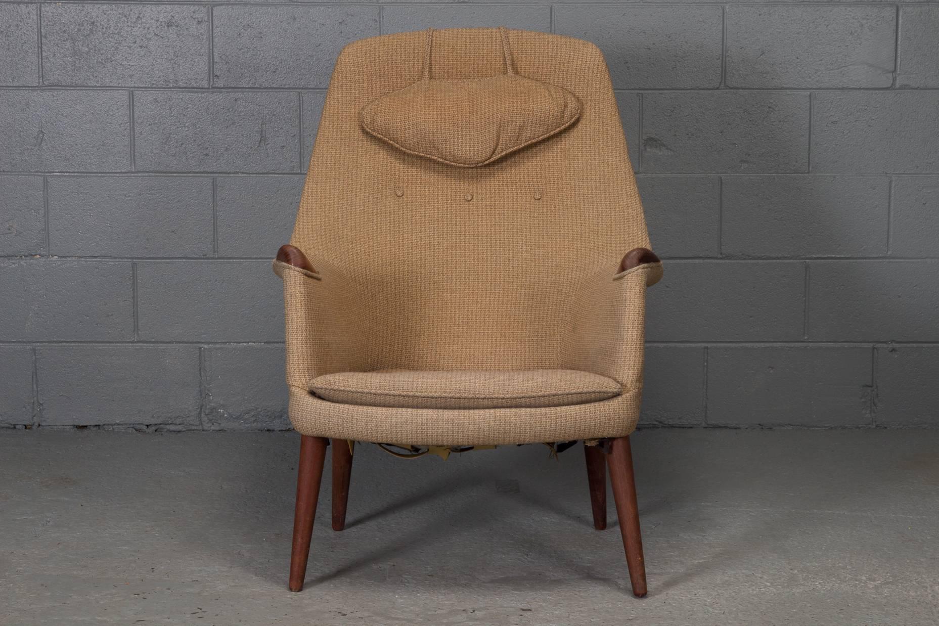 Danish Modern mid-century teak and fabric lounge chair in the style of Hans Wegner's Mama Bear Chair.