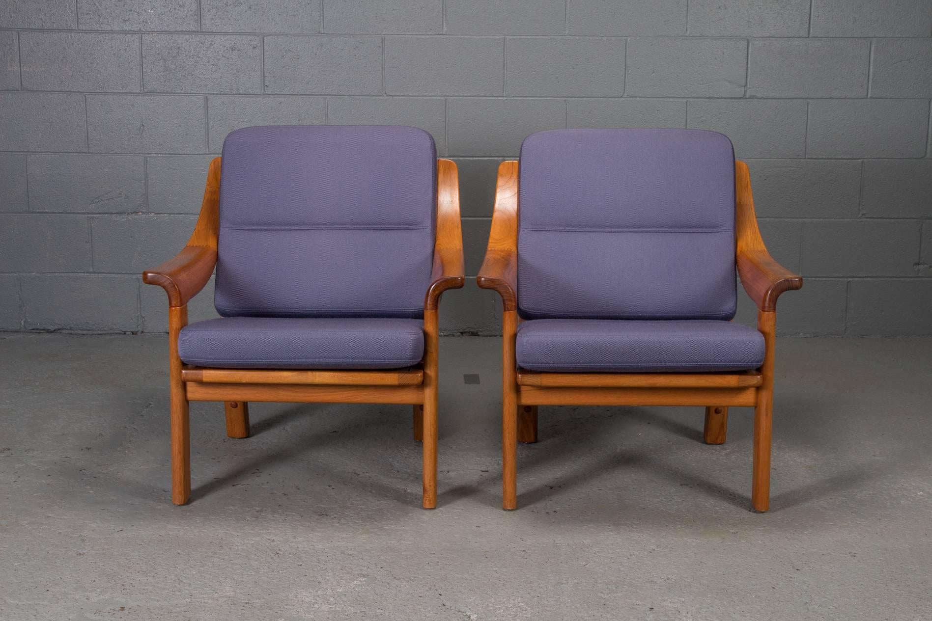 Pair of armchairs with finger joint arms by PJ Danmark. Sturdy, heavy frames and loose cushions.