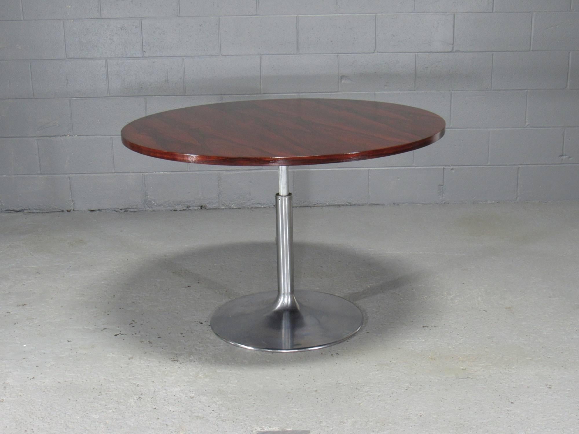 Height-Adjustable Round Rosewood Pedestal Table. Tables raises and lowers with lever. Height can be adjusted from 22