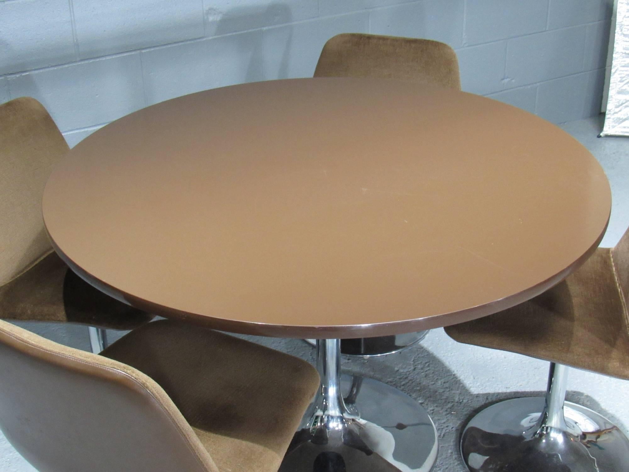 Chrome tulip table and four chairs with brown fabric. Label: Johanson Design. A stunning retro dining set by Borje Johanson, this was made in Sweden and dates from the 1960s. 

Chairs measure 19.5