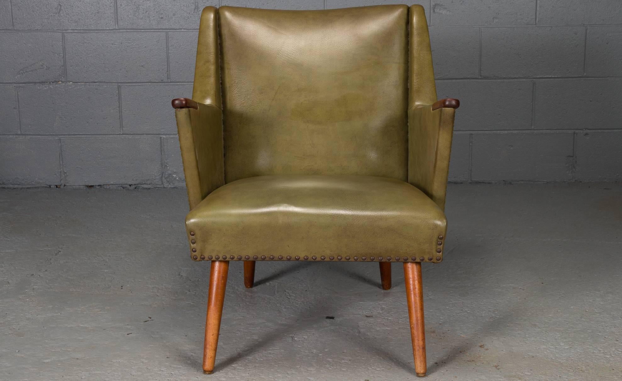 Danish Modern Lounge Chair with Nail Heads and Teak Legs and Paws. 