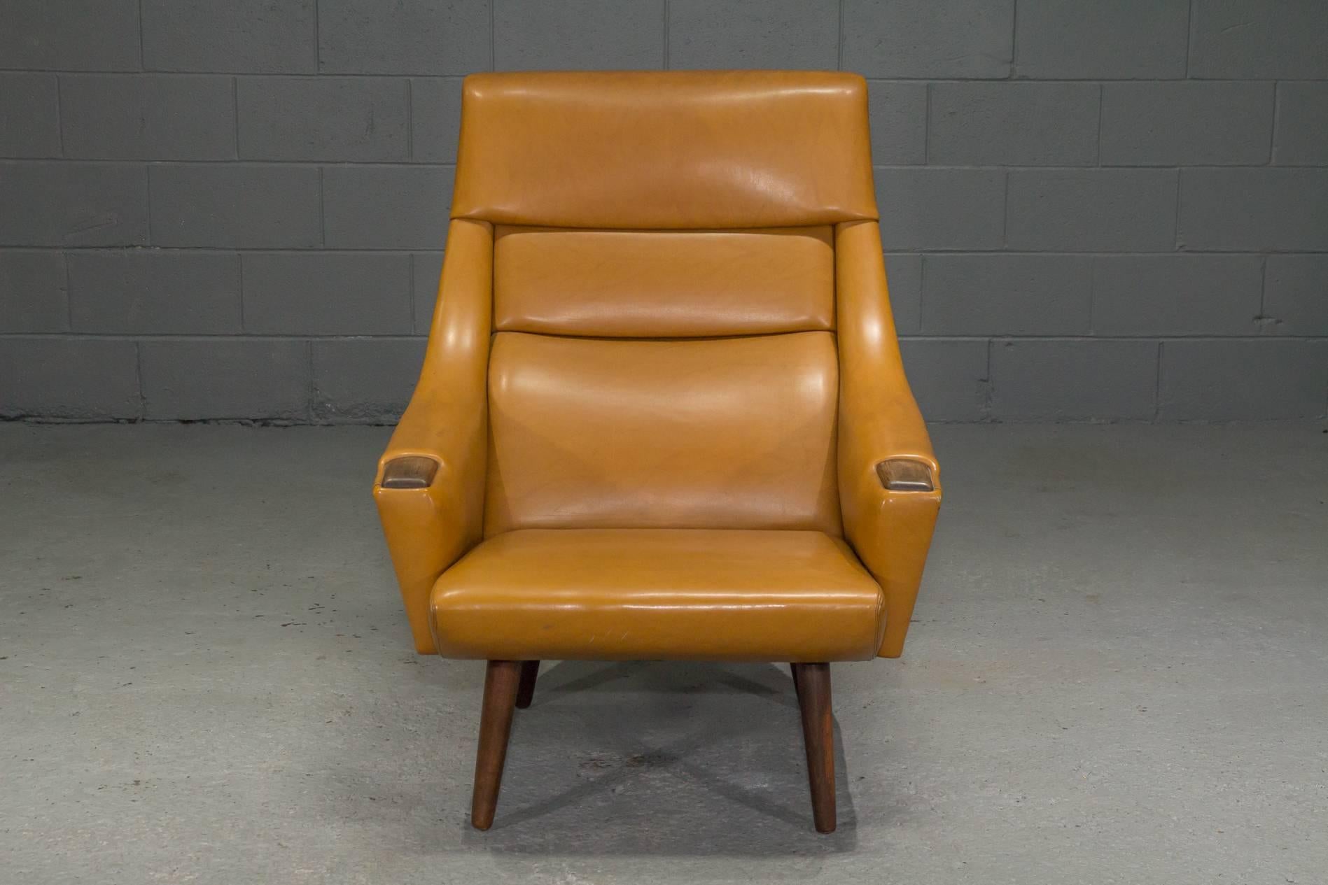 High Back Lounge Chair in Caramel Vinyl. This lounge chair is in all-original condition and is very comfortable.