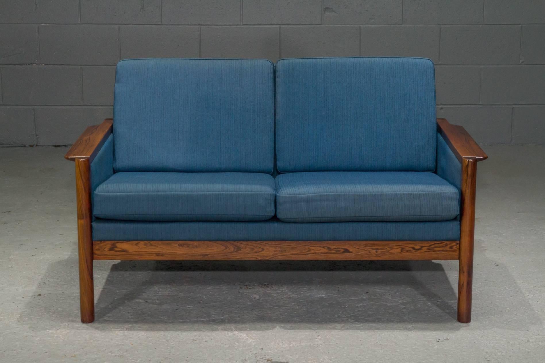 Danish Rosewood Settee with Blue Textile. Solid rosewood frame. Matching armchair and sofa also available.