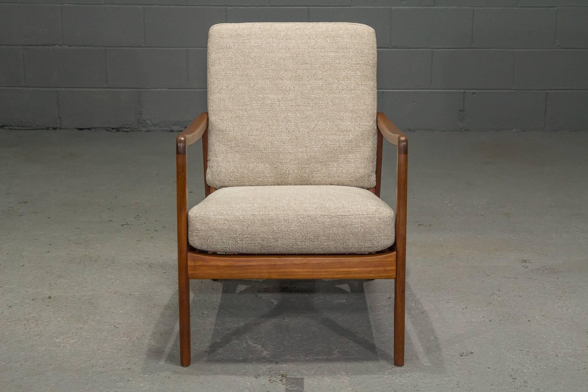 Danish modern teak armchair by Ole Wanscher for France & Son. A classic timeless design. Expertly reupholstered in a neutral textile.