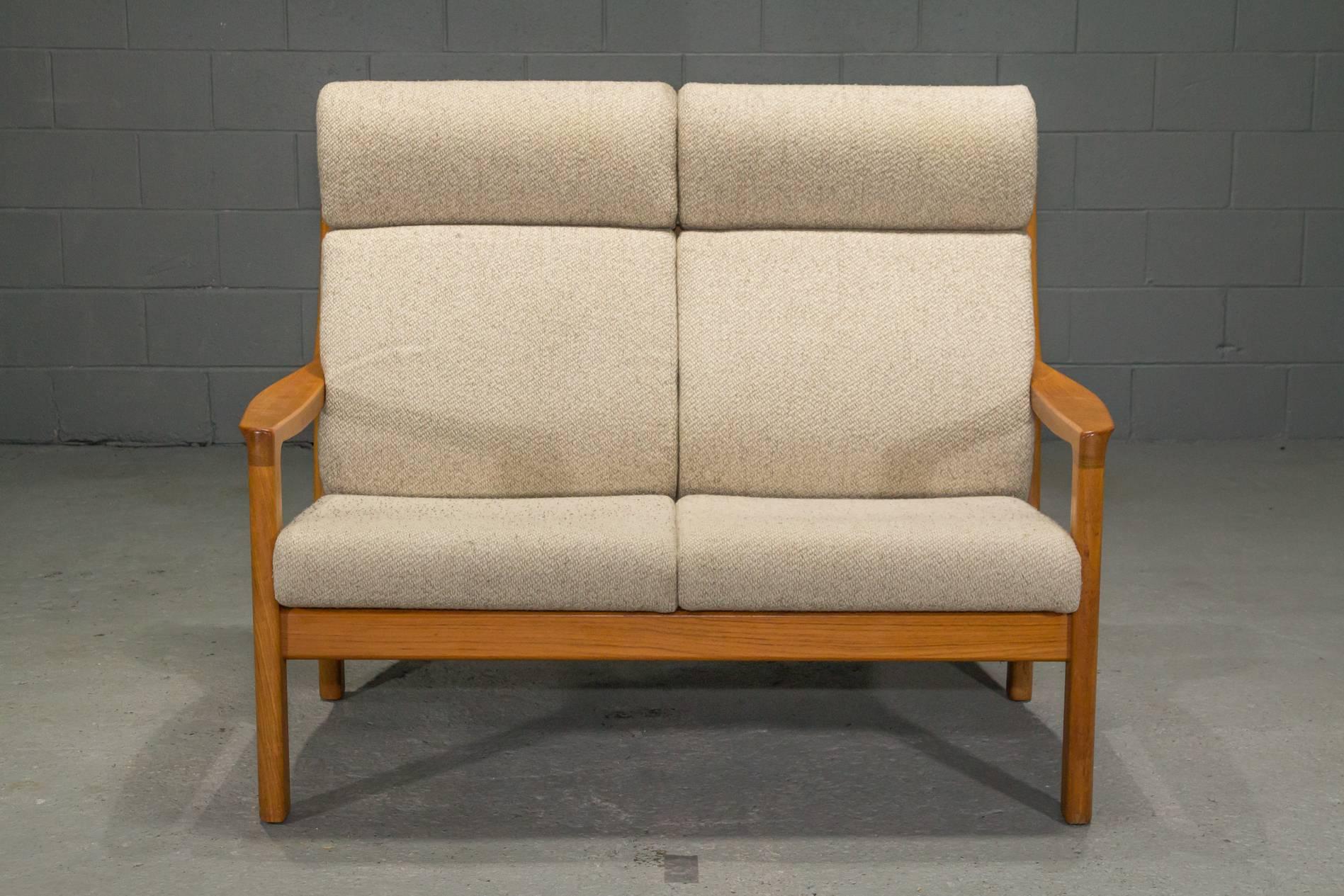 Teak high back loveseat by Johannes Andersen for CFC Silkeborg. Extremely comfortable and supportive.