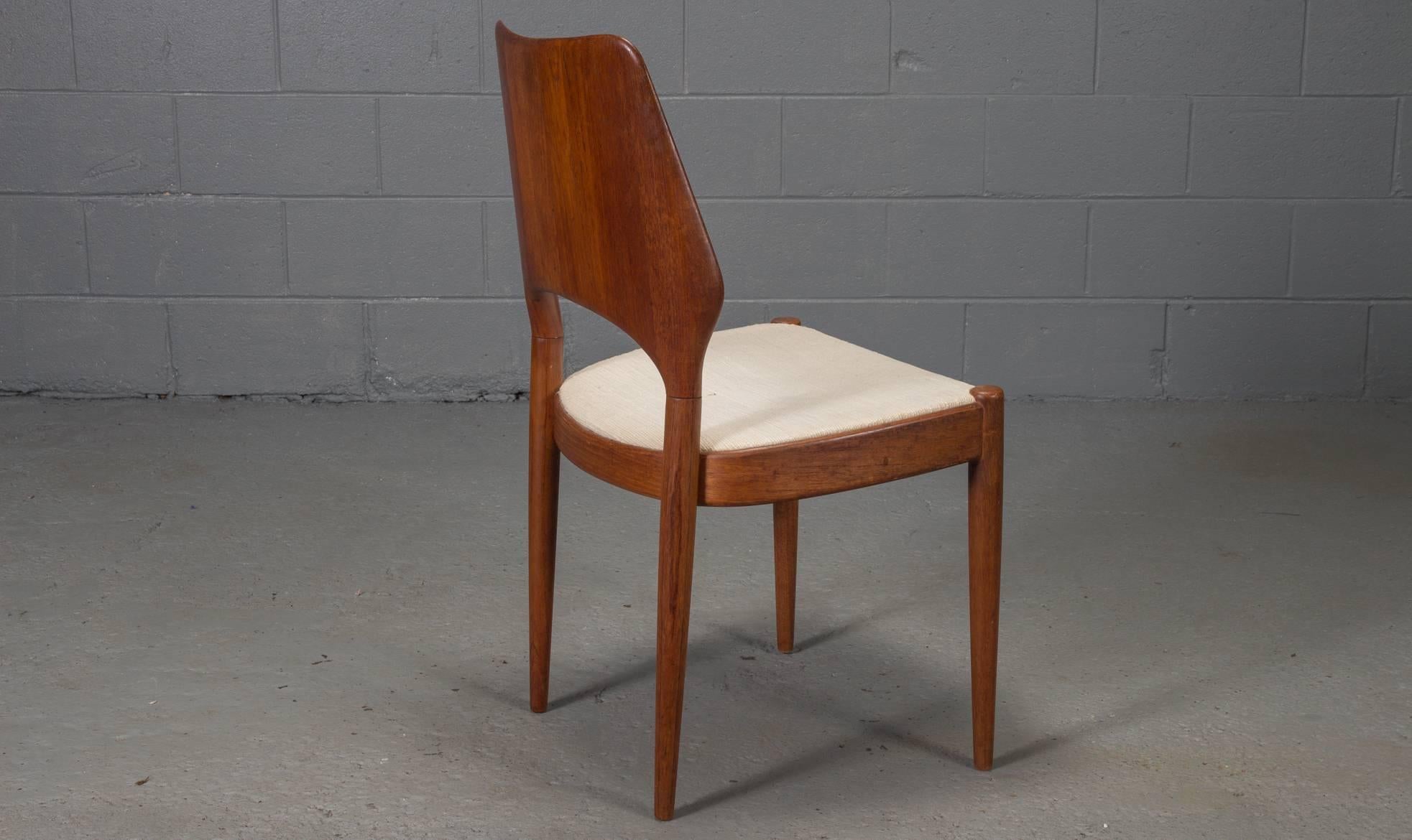 Mid-20th Century Set of Four Danish Modern Solid Teak Finback Dining Chairs, 1950s