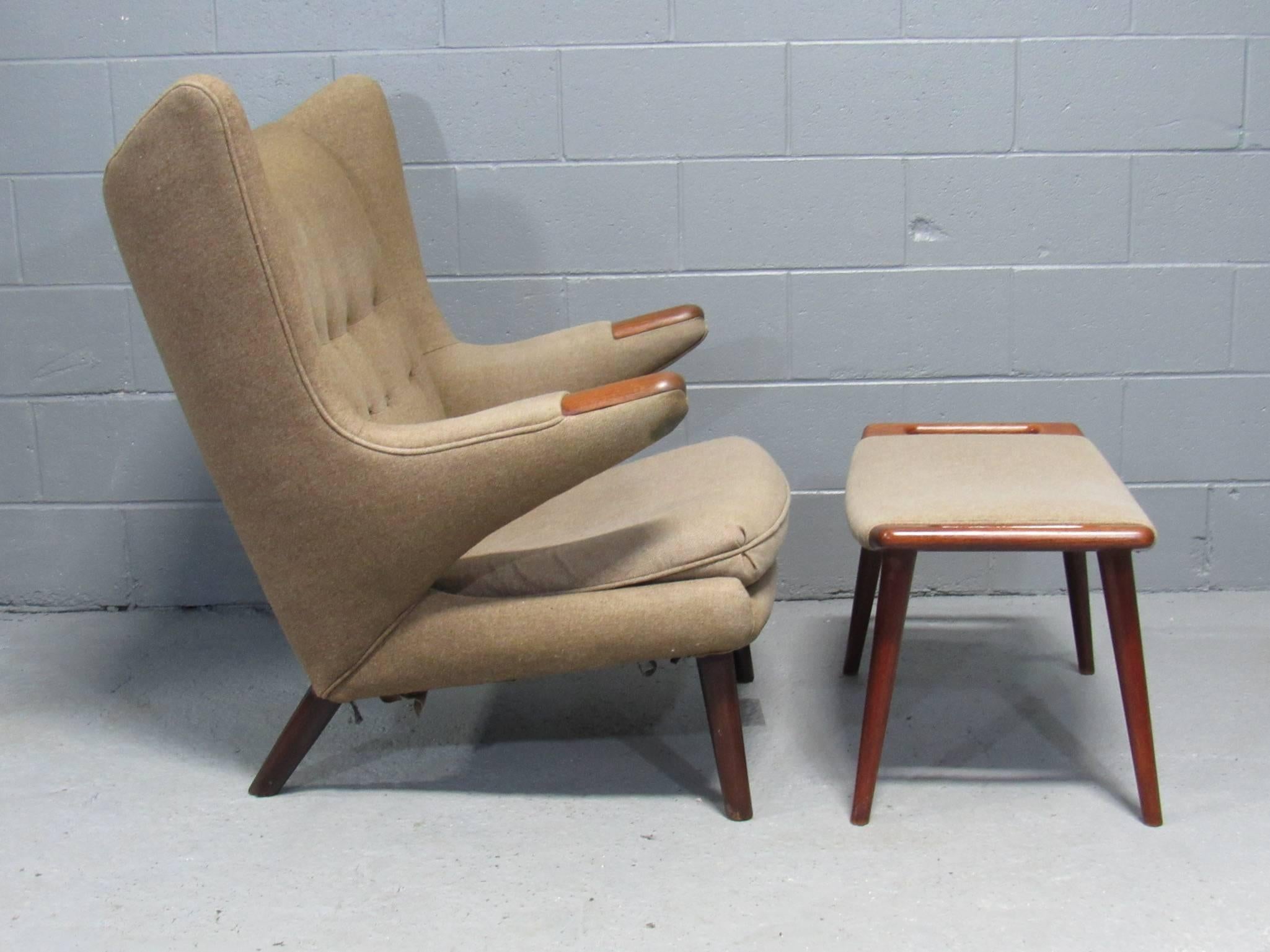 This original Model AP-19 Papa Bear chair and ottoman was designed in 1951 by Hans Wegner for AP Stolen. This early example has been reupholstered at least once and is ready to reupholster in the fabric of your choice.
 