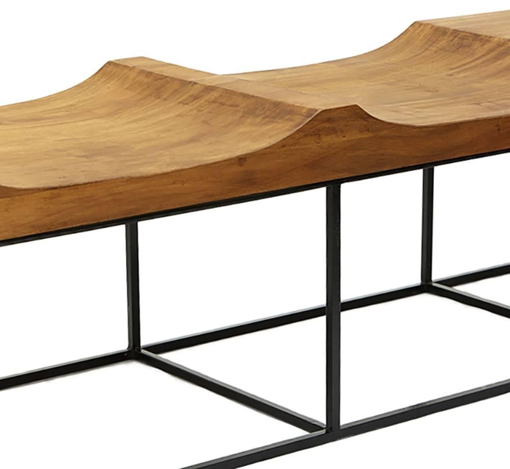 This Brazilian midcentury inspired Marcelo bench is a unique creation by Leon Leon Design from Mexico City. It features a powder-coated steel base and a 100% hand-carved solid Parota wood cover. 

The Parota wood or Huanacaxtle is a tropical or