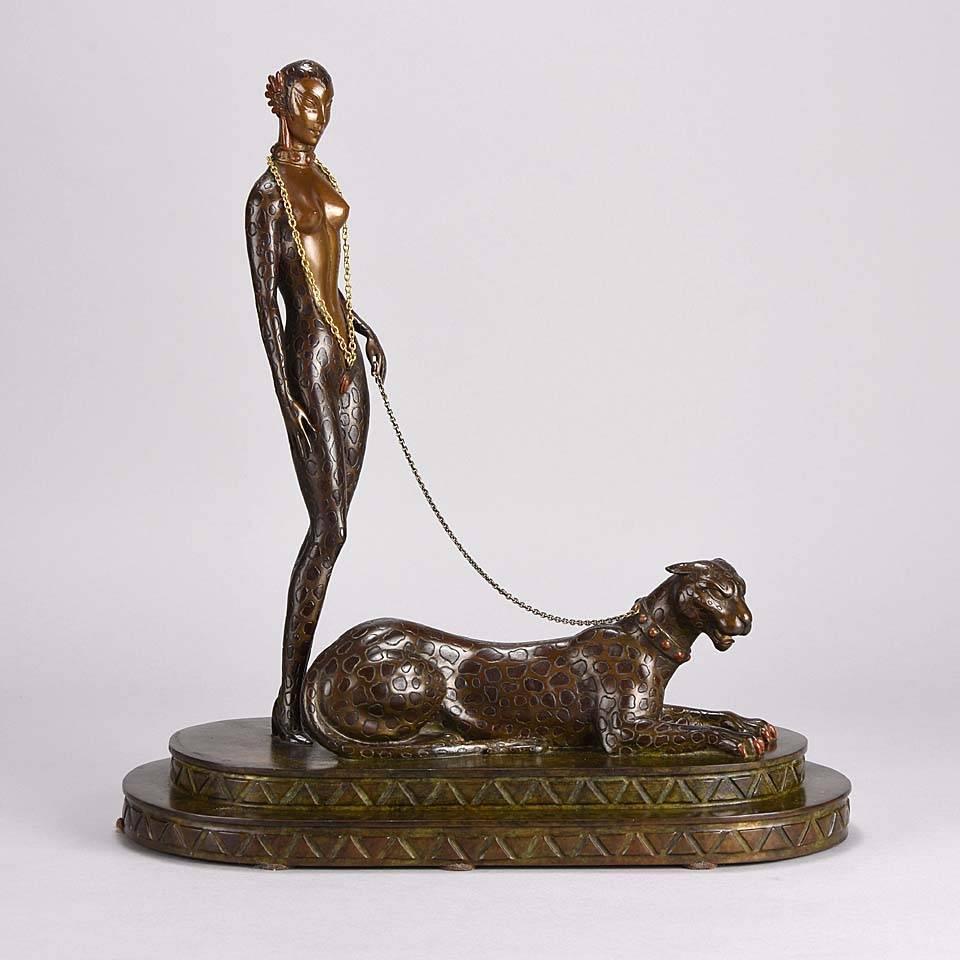A fabulous limited edition bronze study from Ertés Alphabet series representing the letter ‘L’. The bronze of a female figure, half woman and half feline holding a panther on the end of a golden chain, with excellent color and very fine hand