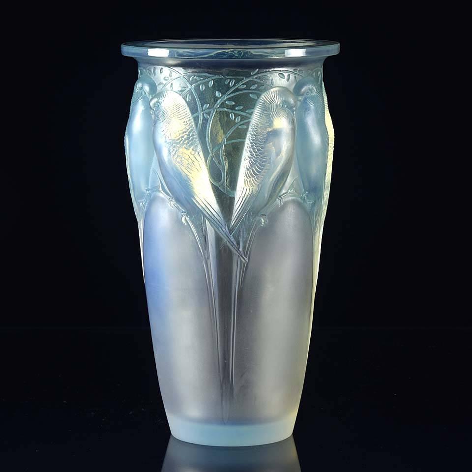 A beautiful early 20th century French Art Deco opalescent Ceylan glass vase, with decorative raised figures of birds amongst branches heightened with noticeable original blue staining. The attractive design, quality and color make this vase much