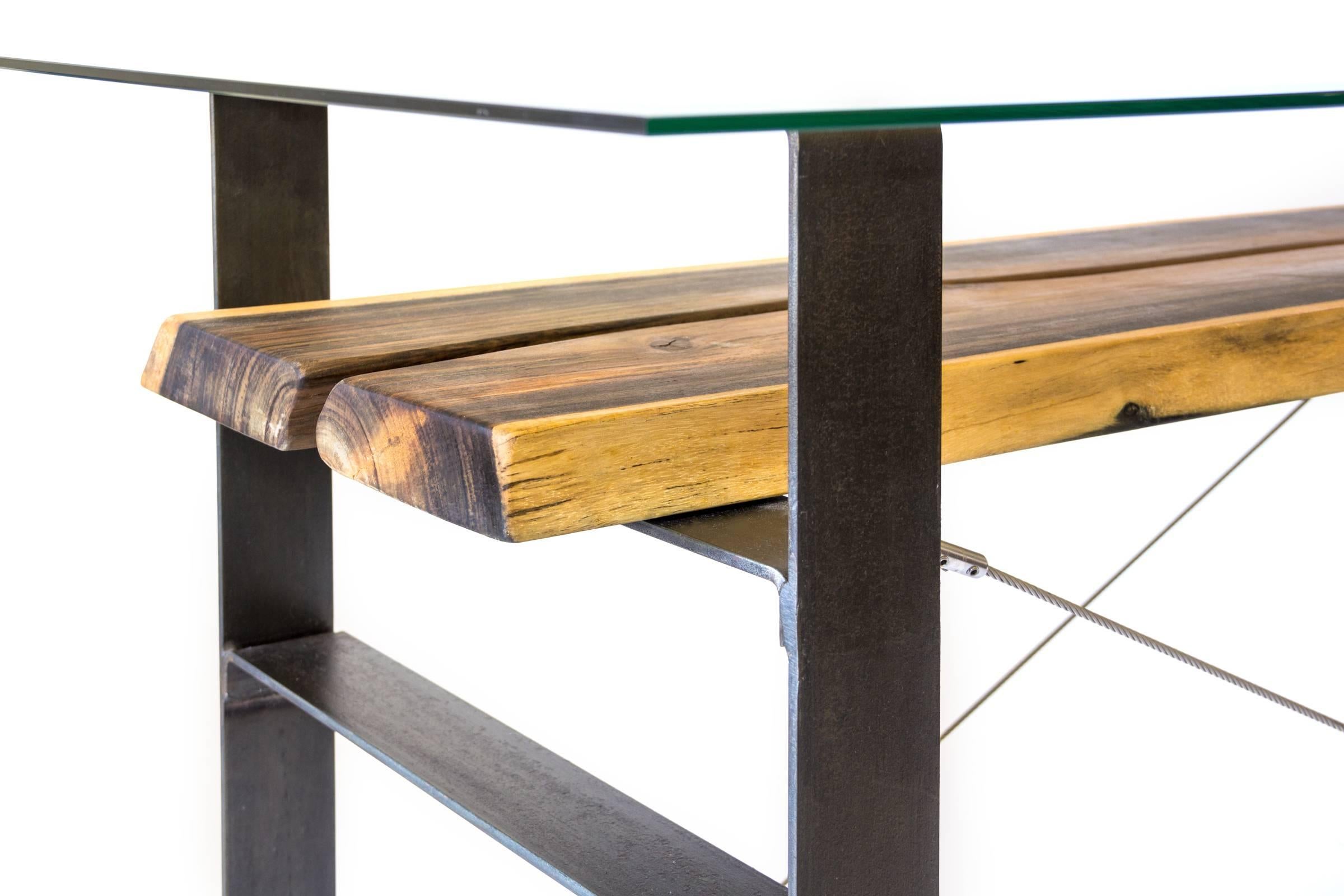 A dining table for up to eight people or just a simple console for your home.

The contrasting base that connects this exotic mahoe wood is made using a stunning black steel and stainless steel cables. Giving an industrial finish to the design,