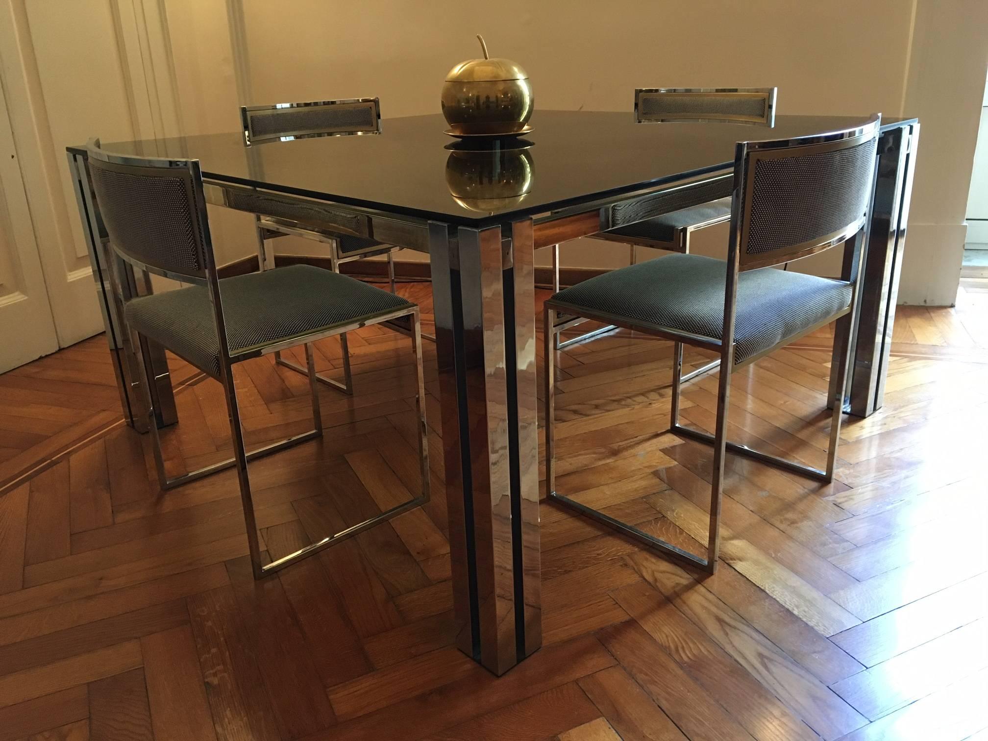 Elegant Italian square brass and chrome dining table attributed to Romeo Rega, 1970s. Smoked crystal top.
