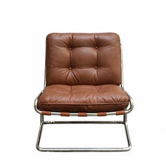 Sillón lounge de piel marrón y tubos de acero cromado, Italia, década de 1970