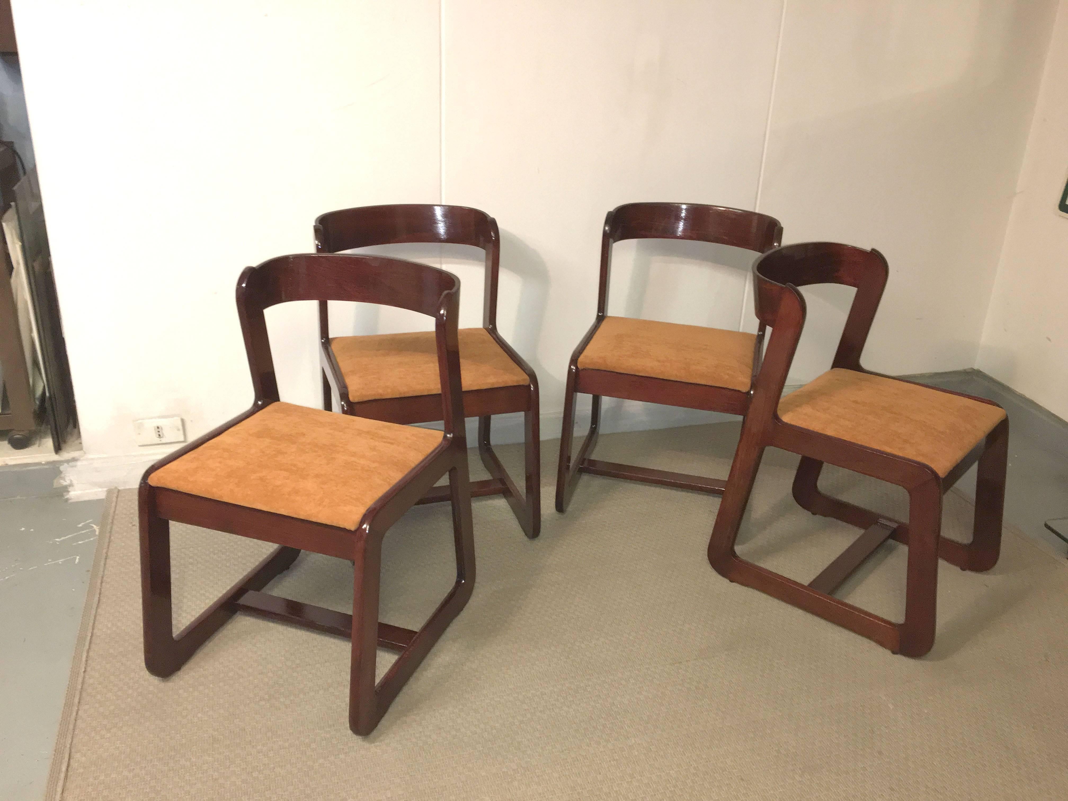 Group of four chairs designed by Willy Rizzo for Mario Sabot. Mahogany frame and velvet seat, Italy, 1970.