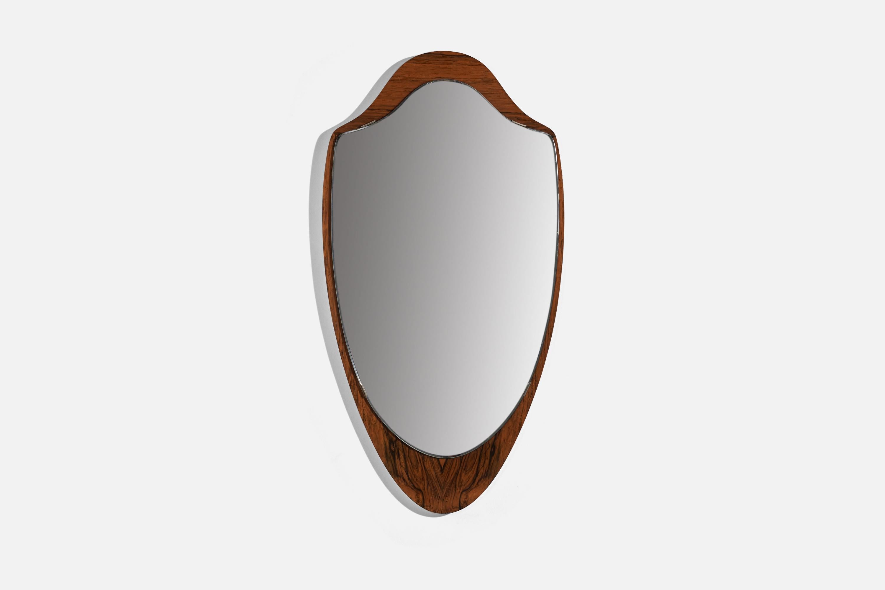 A rosewood wall mirror designed and produced by Glas & Trä, Hovmantorp, Sweden, 1950s, Marked with maker’s label. 