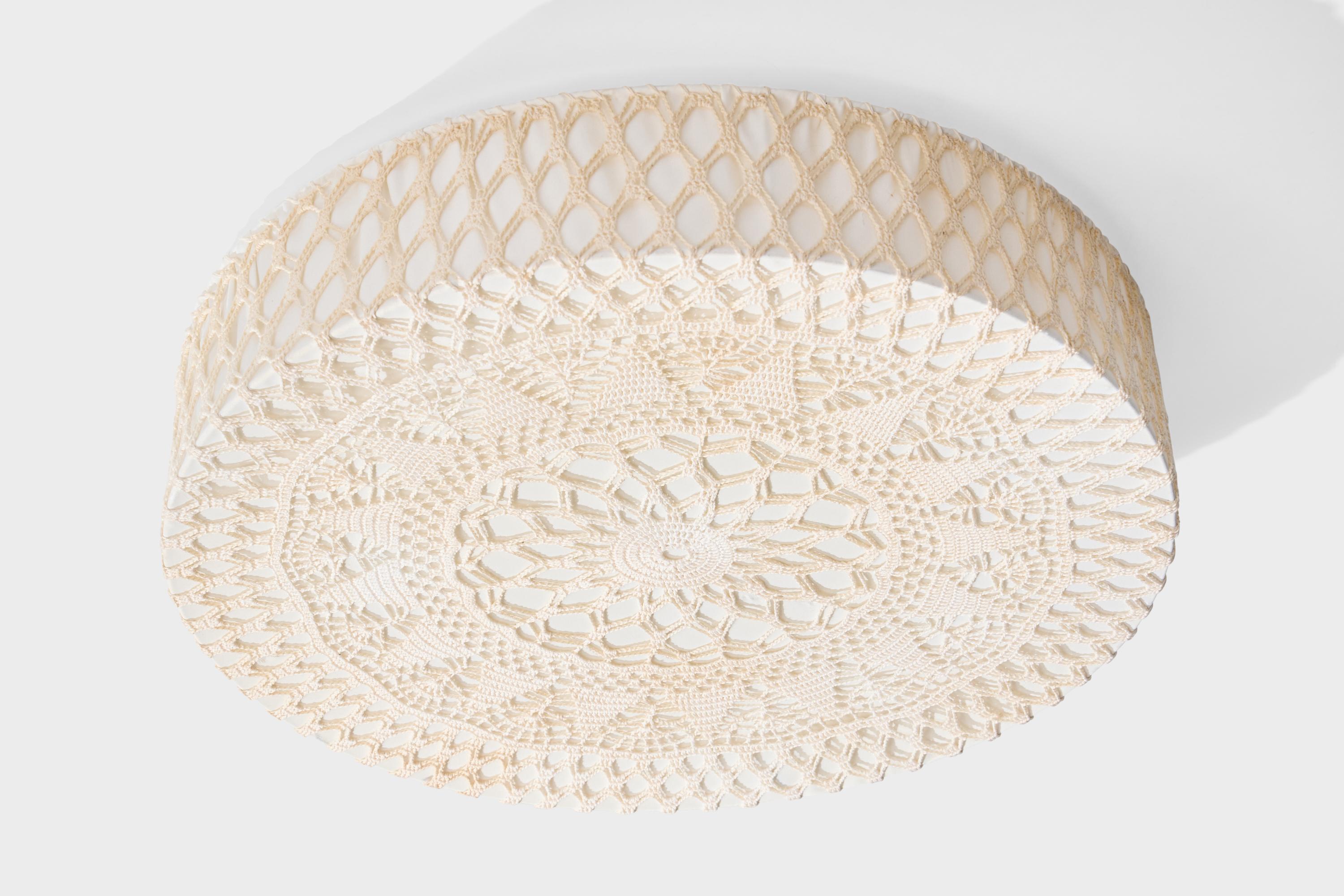 A beige embroidery fabric flush mount designed and produced in Sweden, c. 1970s.

Overall Dimensions (inches): 5.0