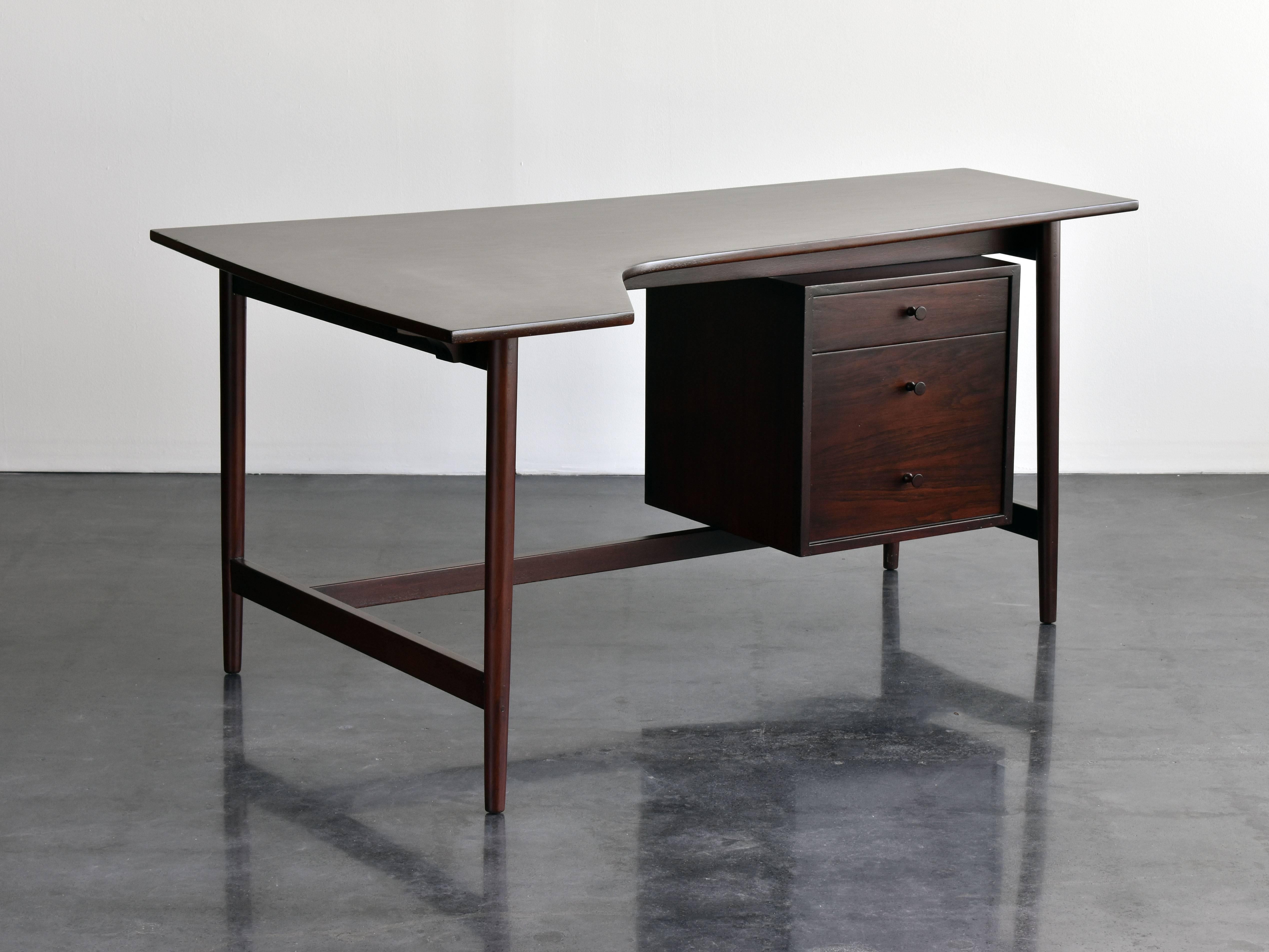 Before moving on to become one of the most influential pop artists of the 20th century Richard Artschwager made a small production of studio furniture. The present desk is an example of these being made by the artist's hand, the desk is signed on