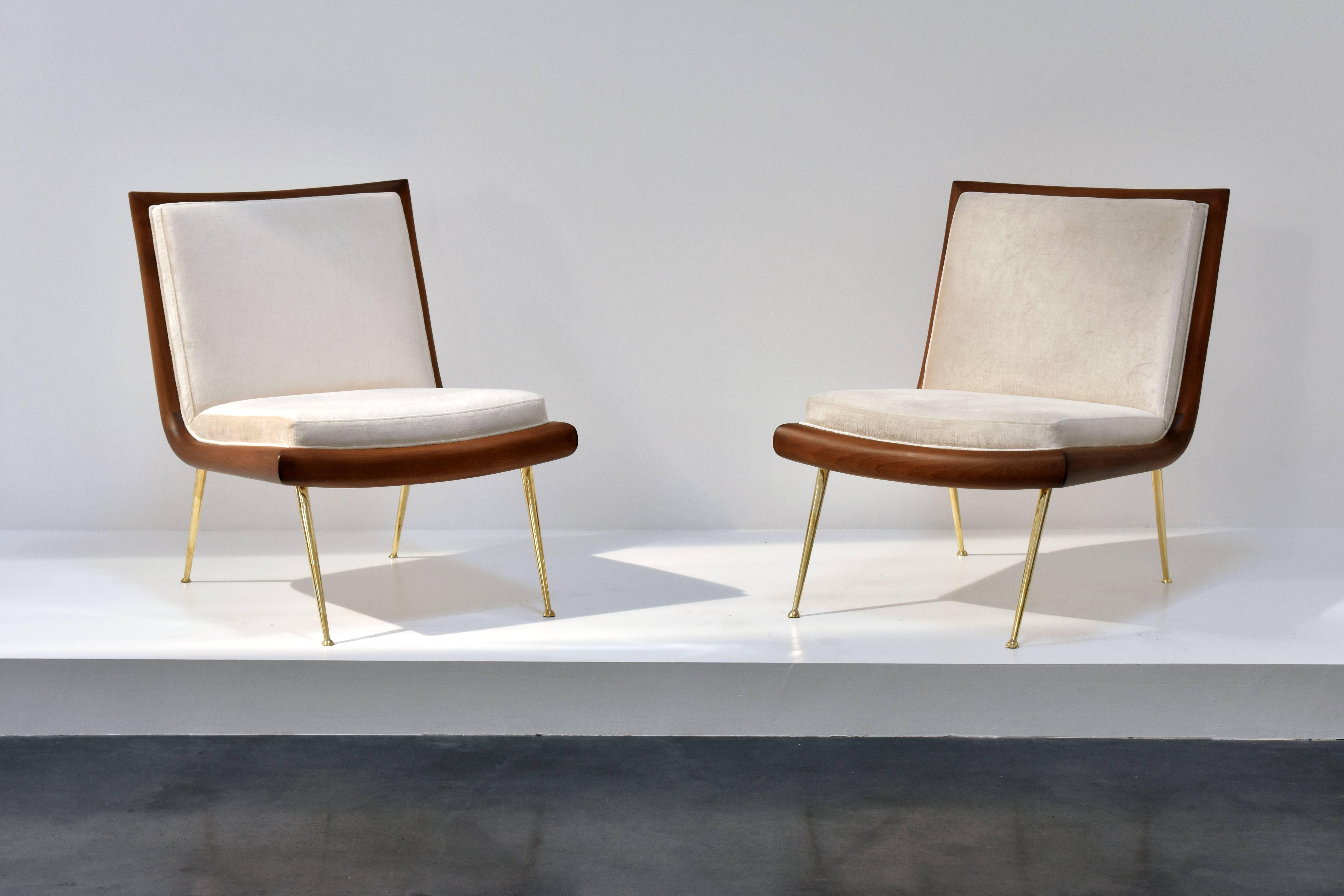 A rare pair of elegant cocktail chairs or slipper chairs designed by T.H. Robsjohn-Gibbings. The dark walnut provides an elegant contrast to the light beige velvet fabric and polished brass legs. Manufactured by The Widdicomb Furniture Company.

 
