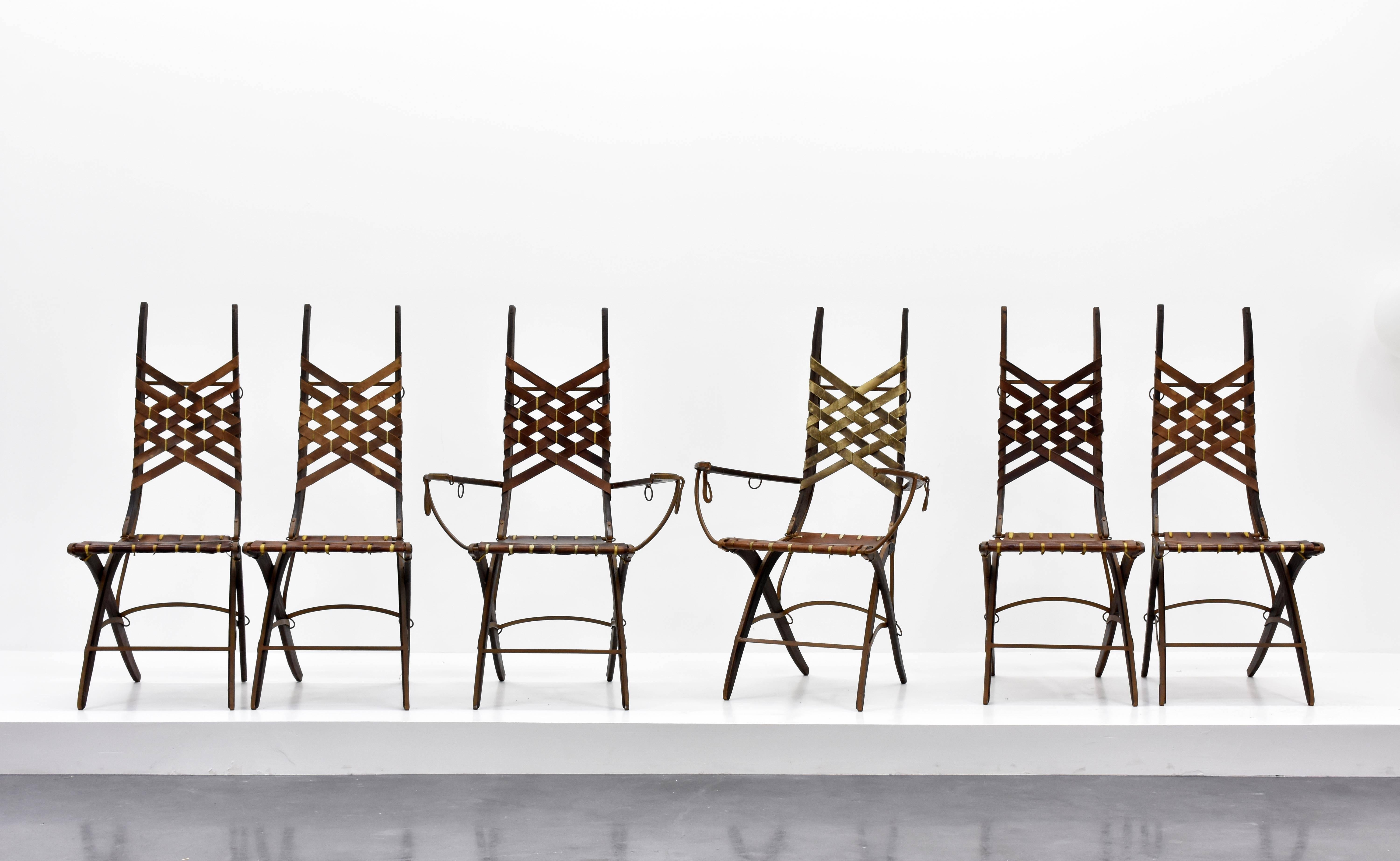 A dining group or side chairs by Italian designer Alberto Marconetti, Italian, 1960s. Design incepted in Milan in a similar vein as works by Gabriella Crespi and Carlo Bugatti. Executed in Iron, oak, leather, and hand-signed as illustrated in the