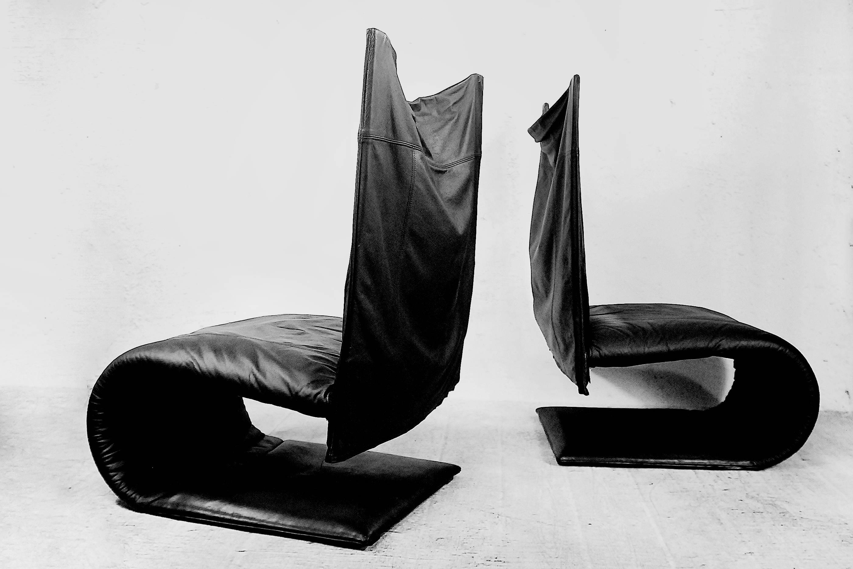 This set of two French Zen chairs was designed by Claude Brisson for Ligne Roset in the 1980. It is made from real soft leather in a black color. It has a modern form and is very comfortable. Labelled with a tag and in very good vintage condition