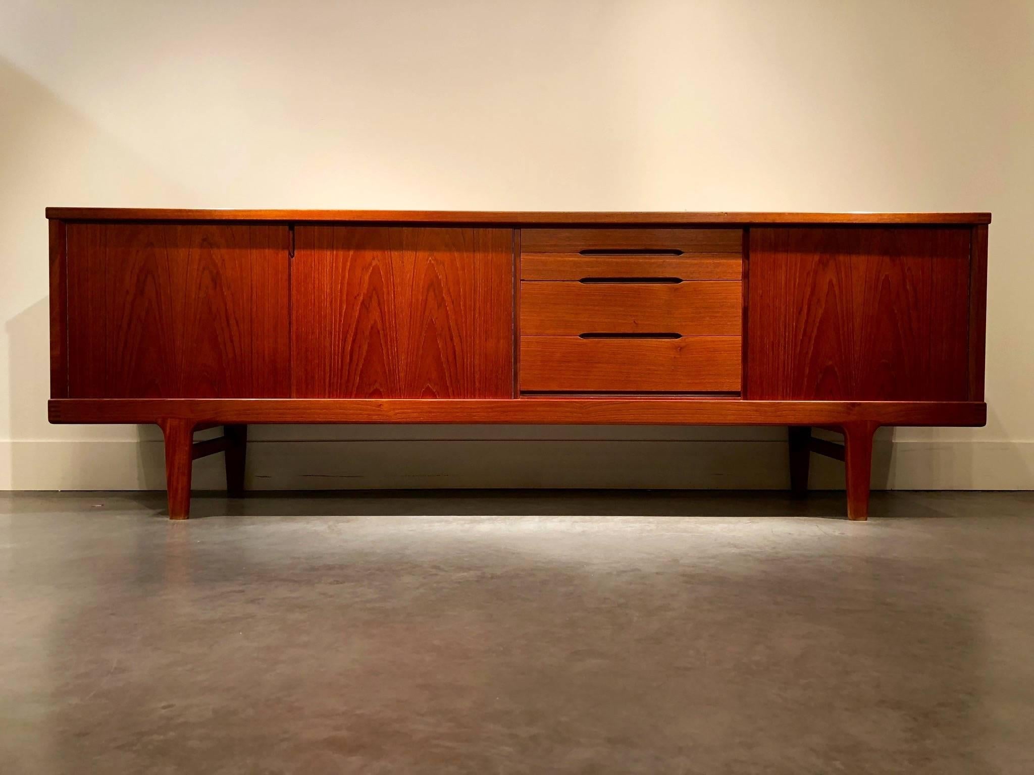 Danish sideboard made of teak with four drawers and three doors.
High quality furniture with dovetail joint at each corner.
Good vintage condition.
Stamped: K&S -made in Denmark on the underside.