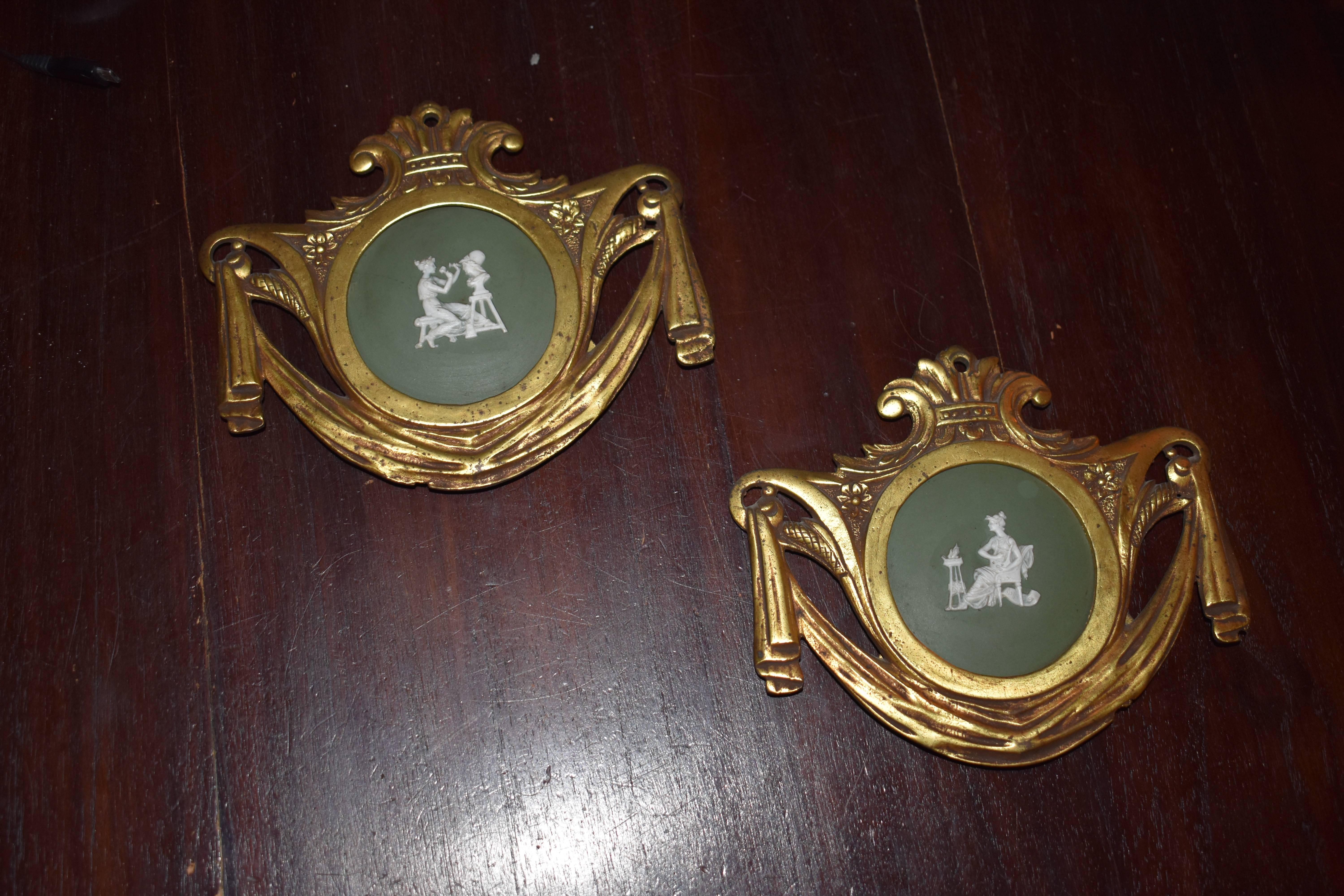 Miniature jasperware ornament plaques framed in gilt bronze, in the style of Wedgwood.

These two miniatures jasperware plaques have a dark green center which provides a lovely background for the neoclassical relief. The details of the plaques are