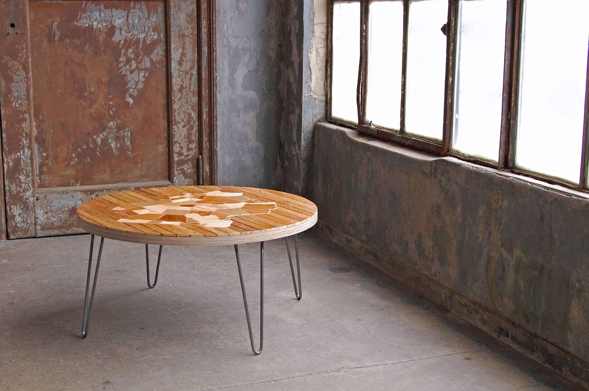 Round reclaimed wood coffee table / cocktail table with Brooklyn map inlaid using marquetry technique. The wood pieces come from and represent different neighborhoods of Brooklyn as a discourse on our relationship with the old and new. The legs can