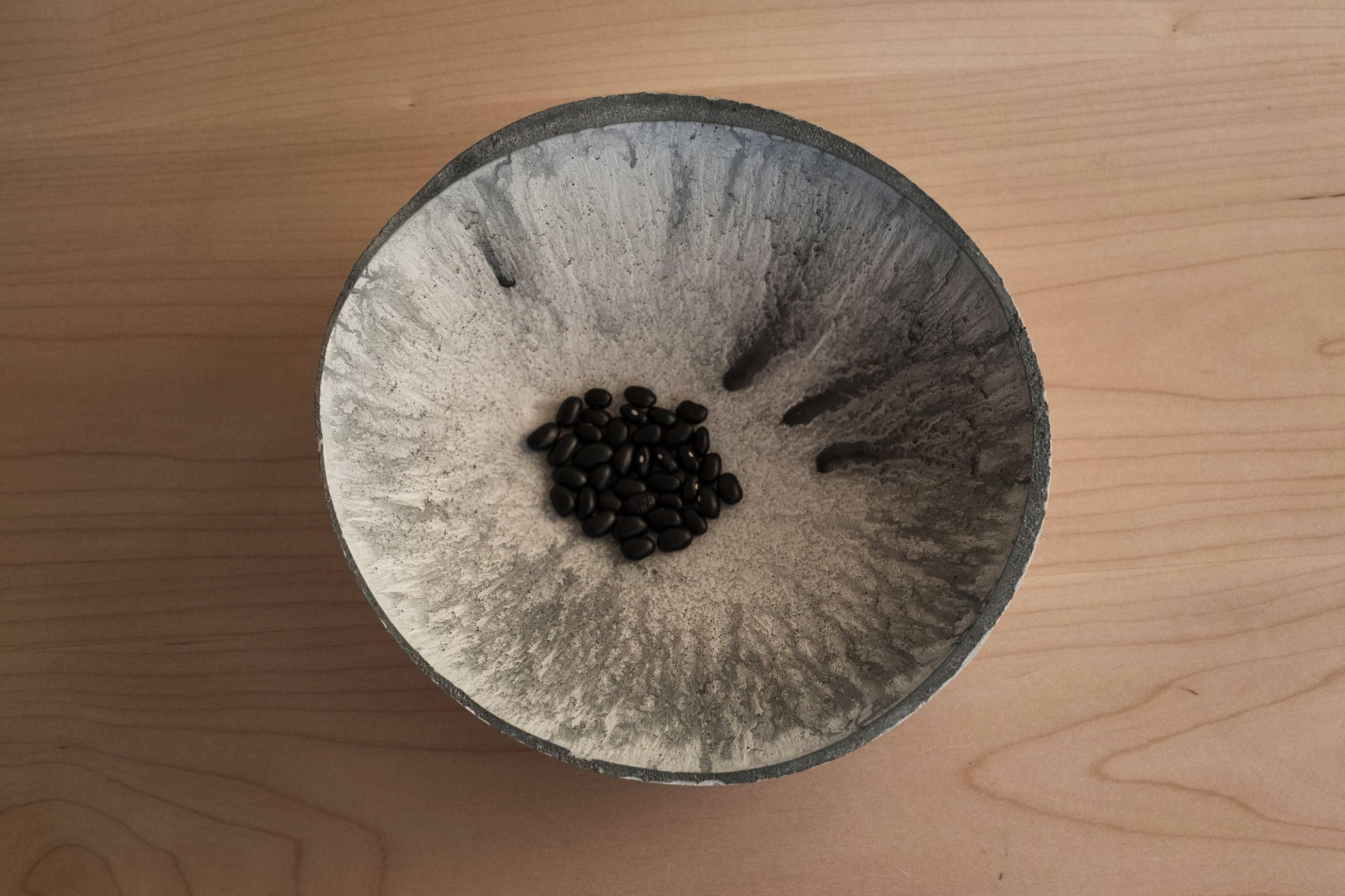 A collection of 200 unique bowls, the Concrete series by UMÉ Studio expresses the tension between heavy concrete and its delicate edge generated by hand pouring. While one assumes concrete should be strong and durable, it is, at its core, fragile.