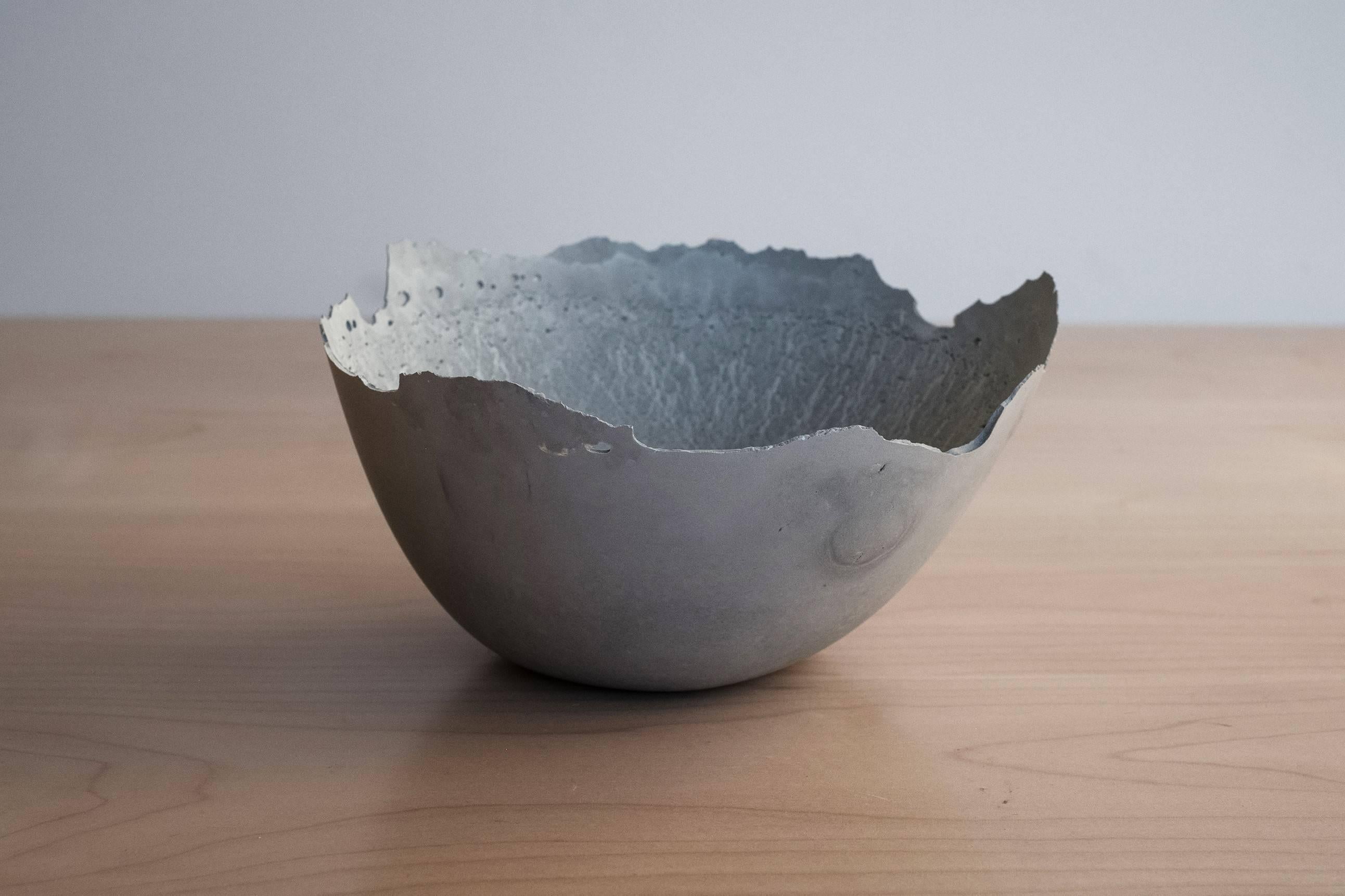A collection of 200 unique bowls, the Concrete series by UMÉ Studio expresses the tension between heavy concrete and its delicate edge generated by hand pouring. While one assumes concrete should be strong and durable, it is, at its core, fragile.