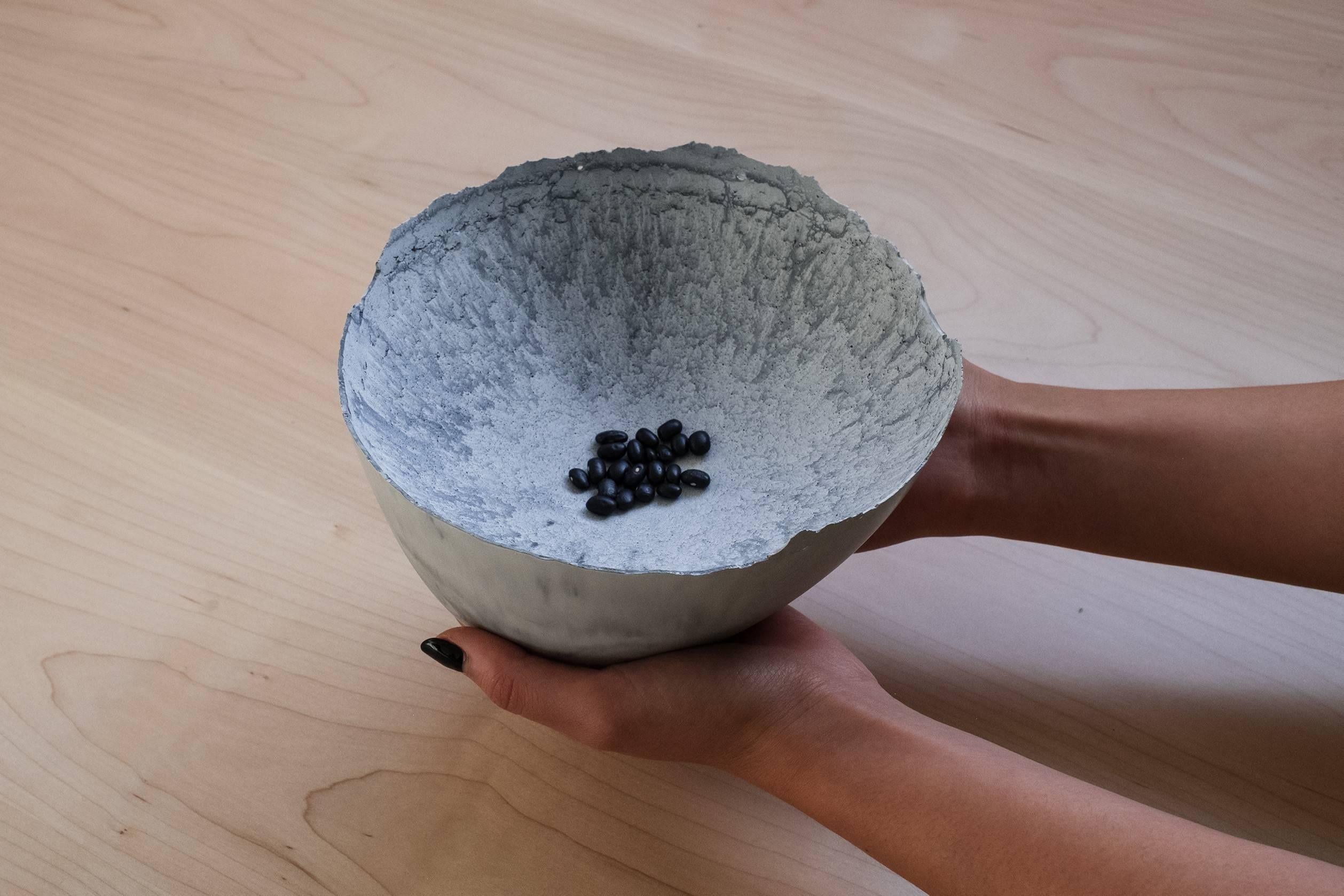 A collection of 200 unique bowls, the Concrete Series by UMÉ Studio expresses the tension between heavy concrete and its delicate edge generated by hand pouring. While one assumes concrete should be strong and durable, it is, at its core, fragile.