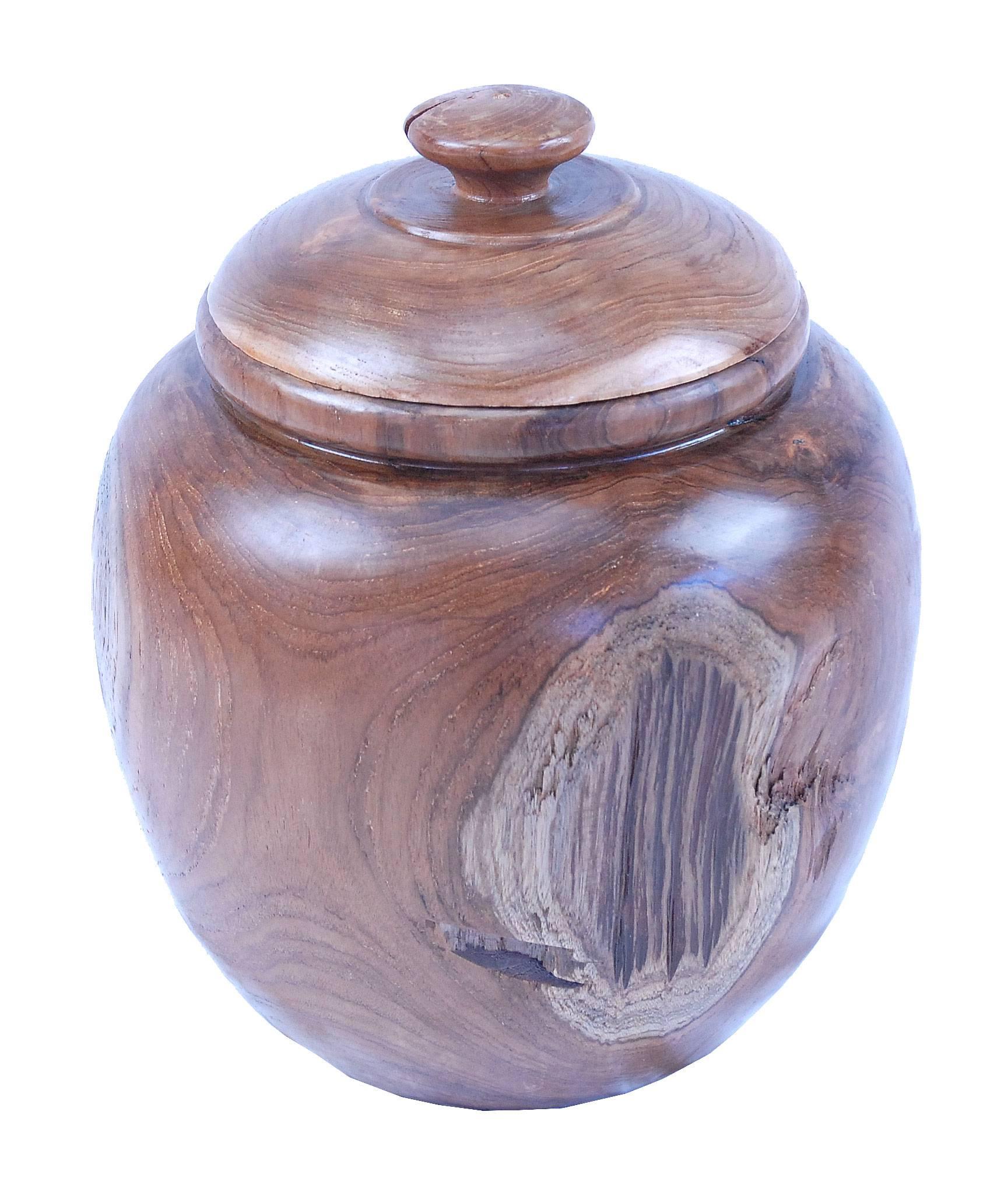 Sustainably harvested hand carved teak Jar.