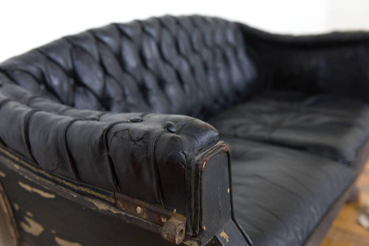 Belgian Small Buttoned Black Leather Carriage Sofa on Cast Iron Legs