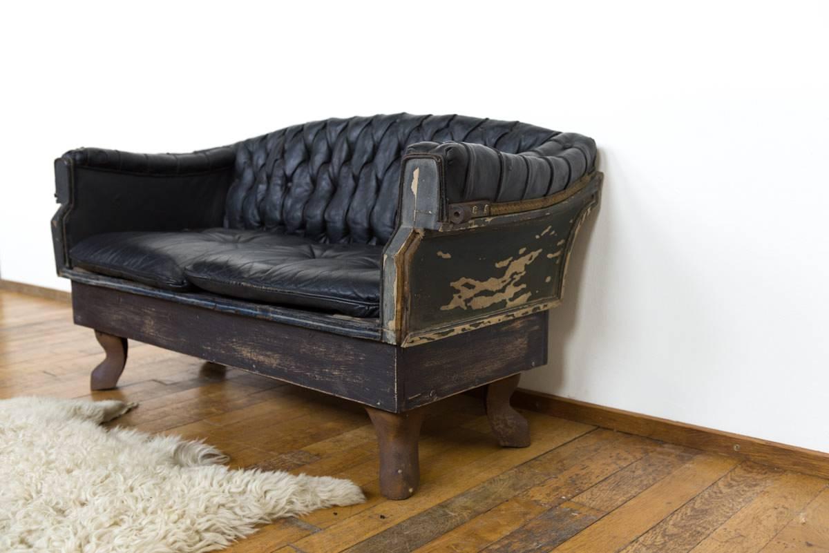 Small Buttoned Black Leather Carriage Sofa on Cast Iron Legs In Distressed Condition In Noord-Brabant, NL