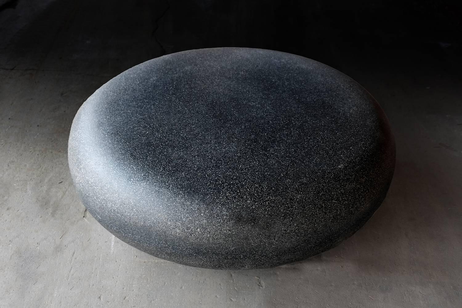 Like a stone from a stream, smoothed for millennia by the passing currents. The fluid potential of natural power emanates from its presence.

Dimensions: Diameter 48 in. (122 cm). Height 15 in. (38 cm). Weight 70 lbs. (32 kg).

Finish color