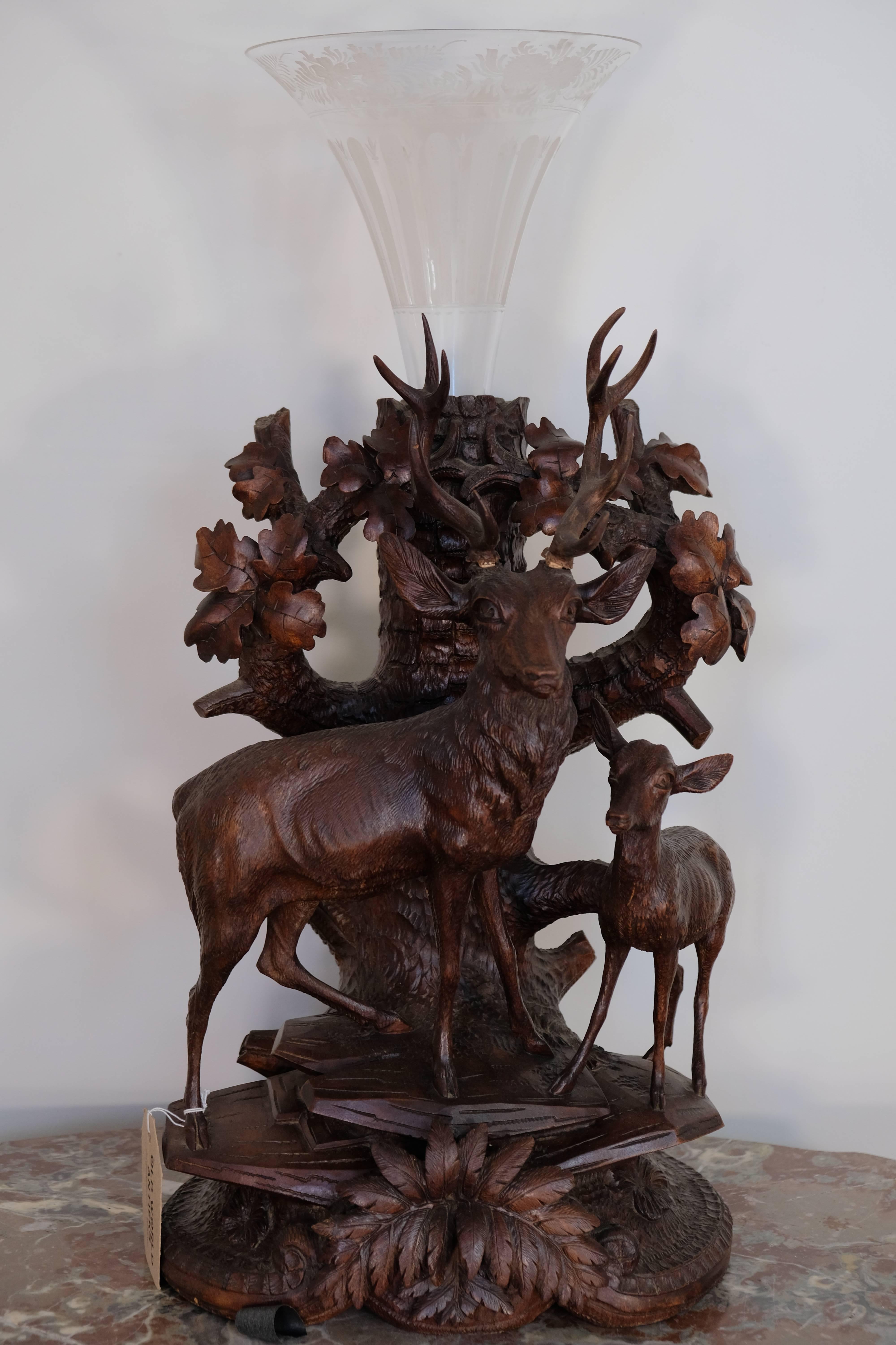Three-piece large black forest mantel clock, circa 1880s, lindenwood carving of stags and doe. Beautiful detail.